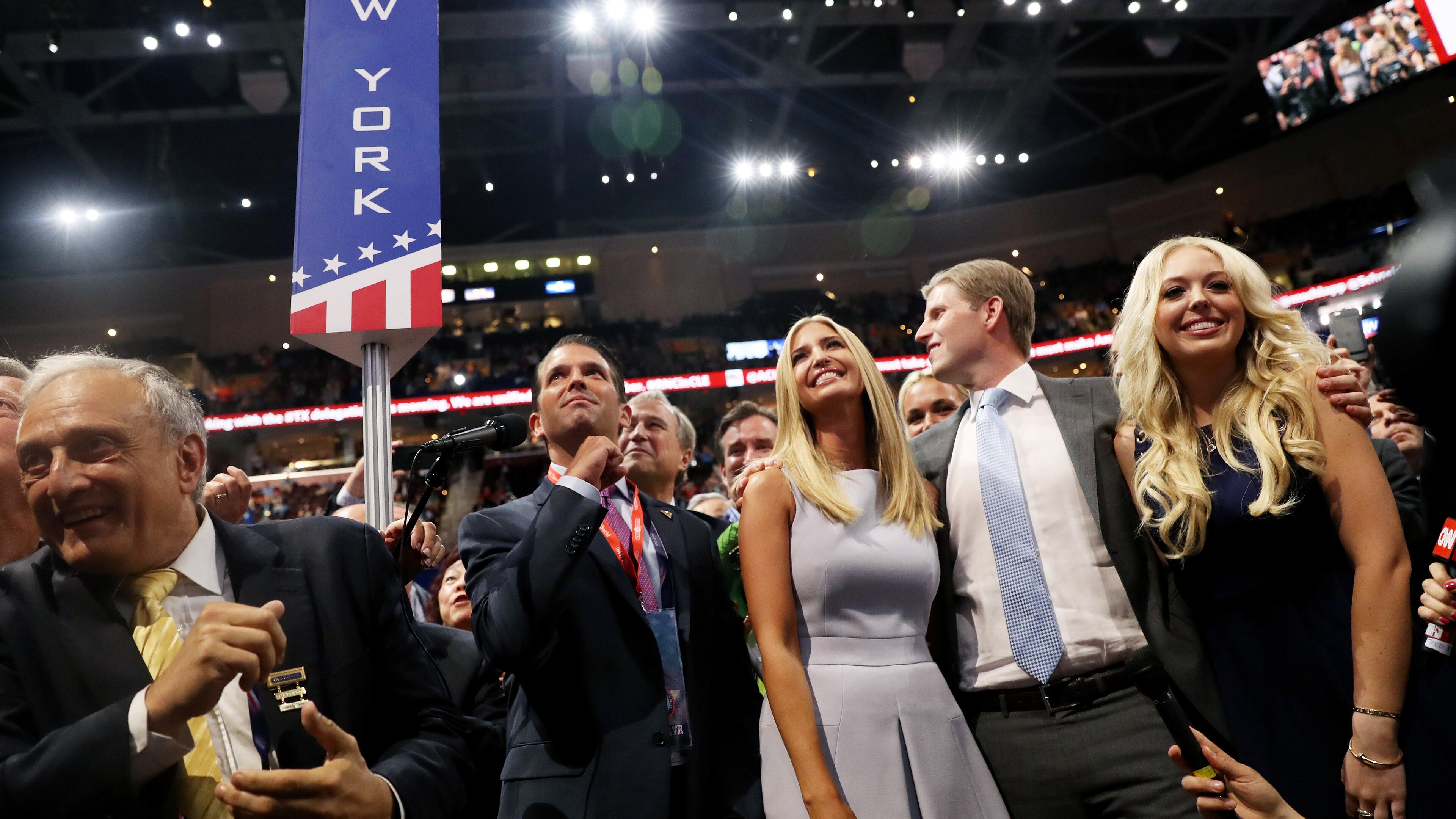 Donald Trump Jr. (2nd-L), along with Ivanka Trump (C), Eric Trump (2nd-R) and Tiffany Trump (R), take part in the roll call in support of Republican presidential candidate Donald Trump on the second day of the Republican National Convention on Tuesday at the Quicken Loans Arena in Cleveland. Joe Raedle/Getty Images