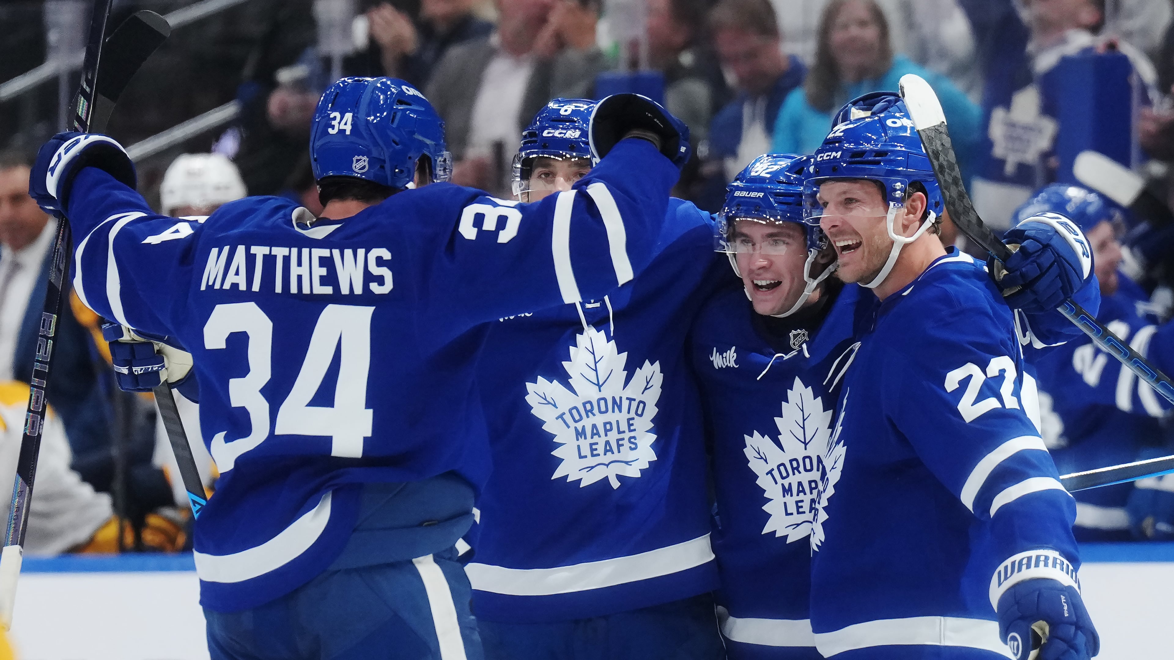 Toronto Maple Leafs' Gavin McKenna (second right) celebrates his goal against the Nashville Predators with Auston Matthews, left to right, Chris Tanev and Jake McCabe during the second period of an NHL hockey game in Toronto, Tuesday, Oct. 6, 2026. (Nathan Denette/The Canadian Press via AP)