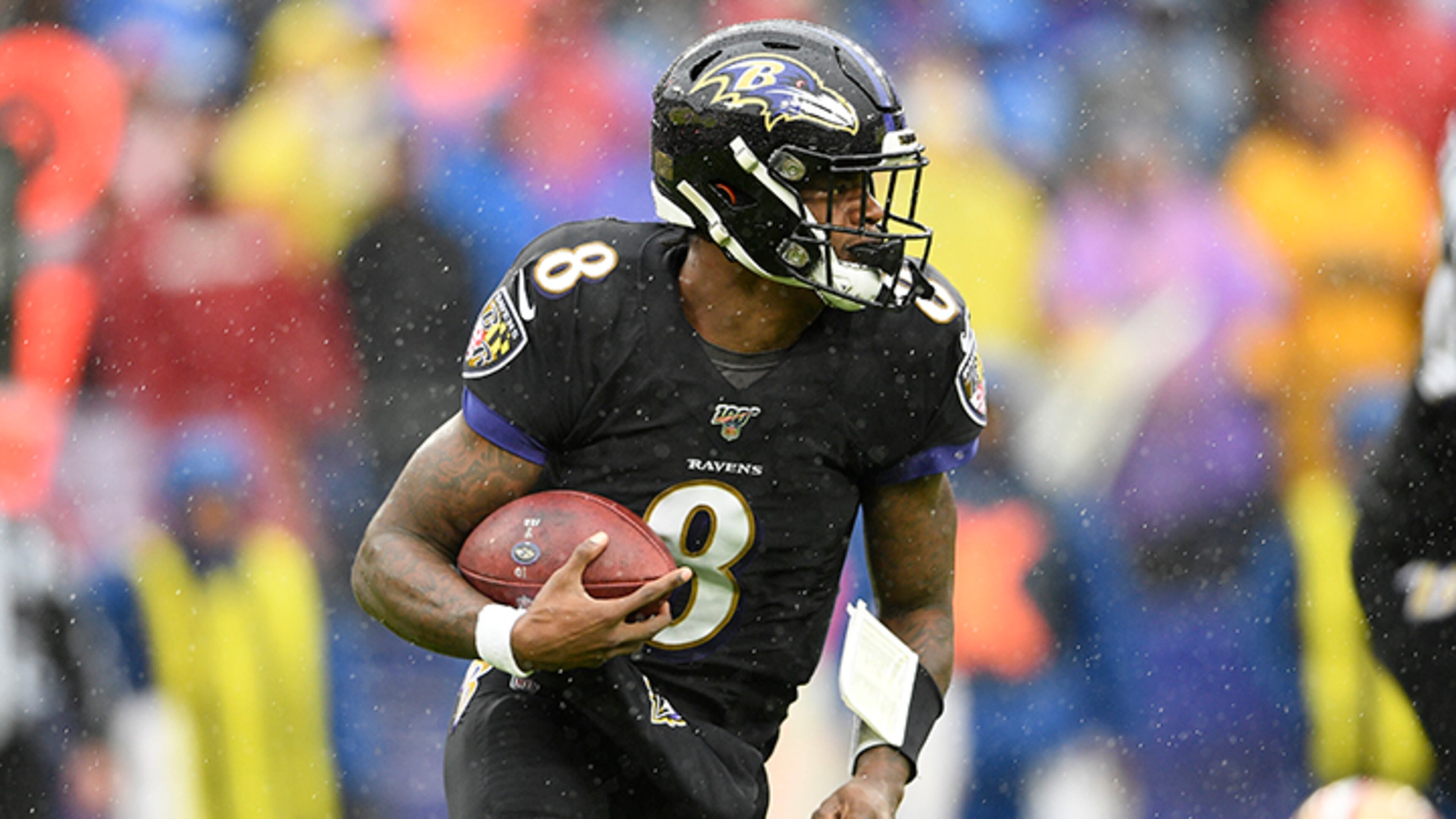 Baltimore Ravens quarterback Lamar Jackson runs with the ball in the first half of a game against the San Francisco 49ers on Dec. 1 in Baltimore.