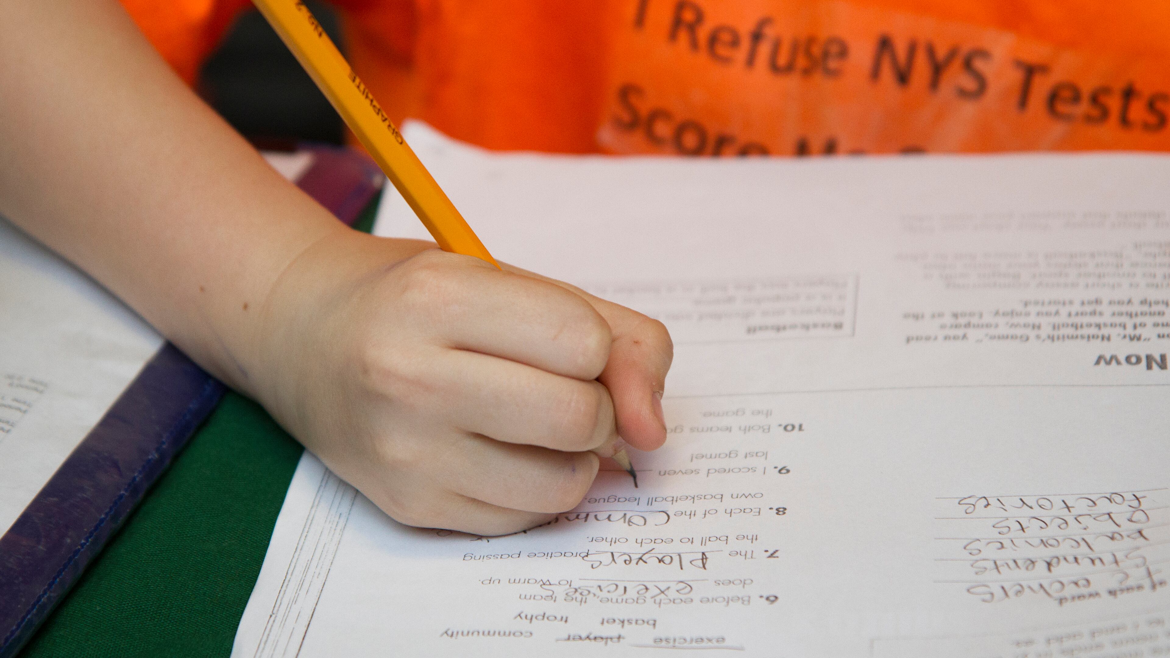 FILE -- Blake Carnright, 10, does homework -- the message on his shirt reflects his mother's decision to opt out of standardized state tests -- at home in Ilion, N.Y., April 22, 2015. This year, twenty percent of New York State?s third through eighth graders sat out at least one standardized test based on new Common Core academic standards, according to education officials, a sign of increasing resistance to testing. (Emma Tannenbaum/The New York Times)