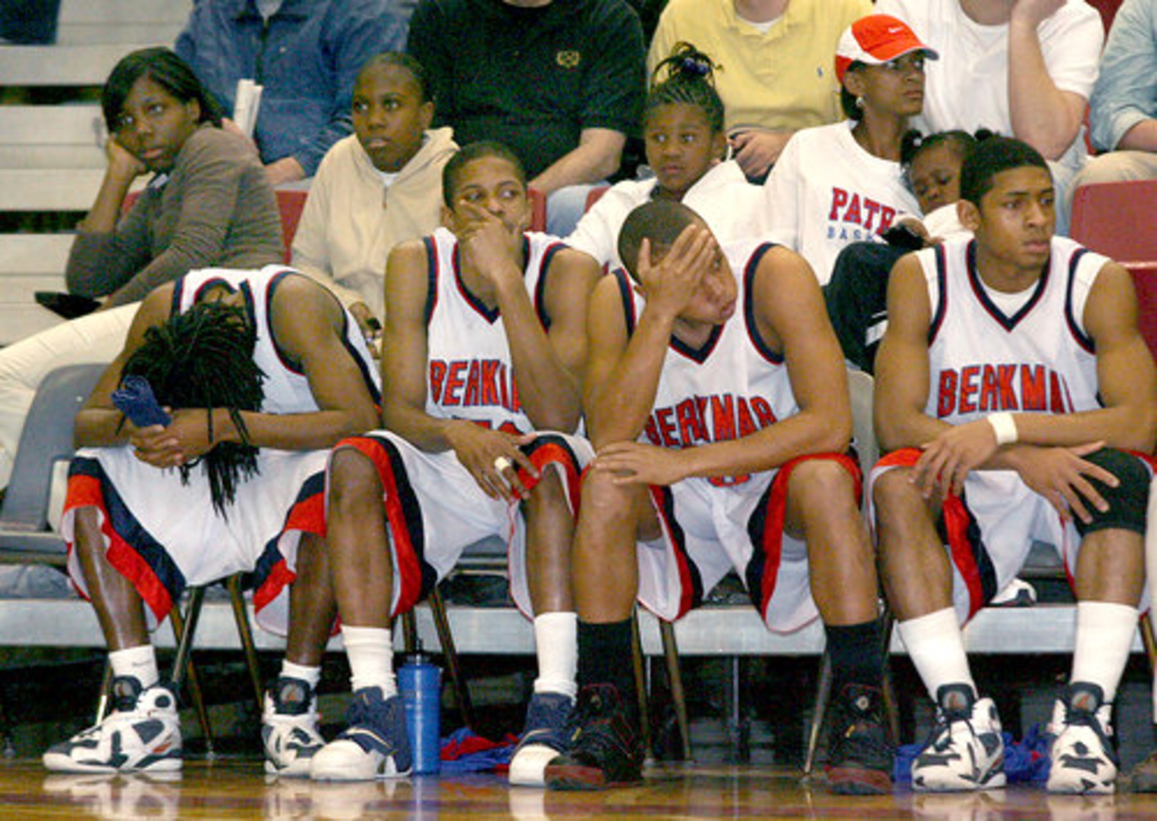 As they watch their season come to an end, Berkmar players including (left to right) Stavantae Rucker, Curley Williams, Ti Smith and Aamir Kelliehan show their disappointment from the bench. Wheeler defeated Berkmar 78-56.