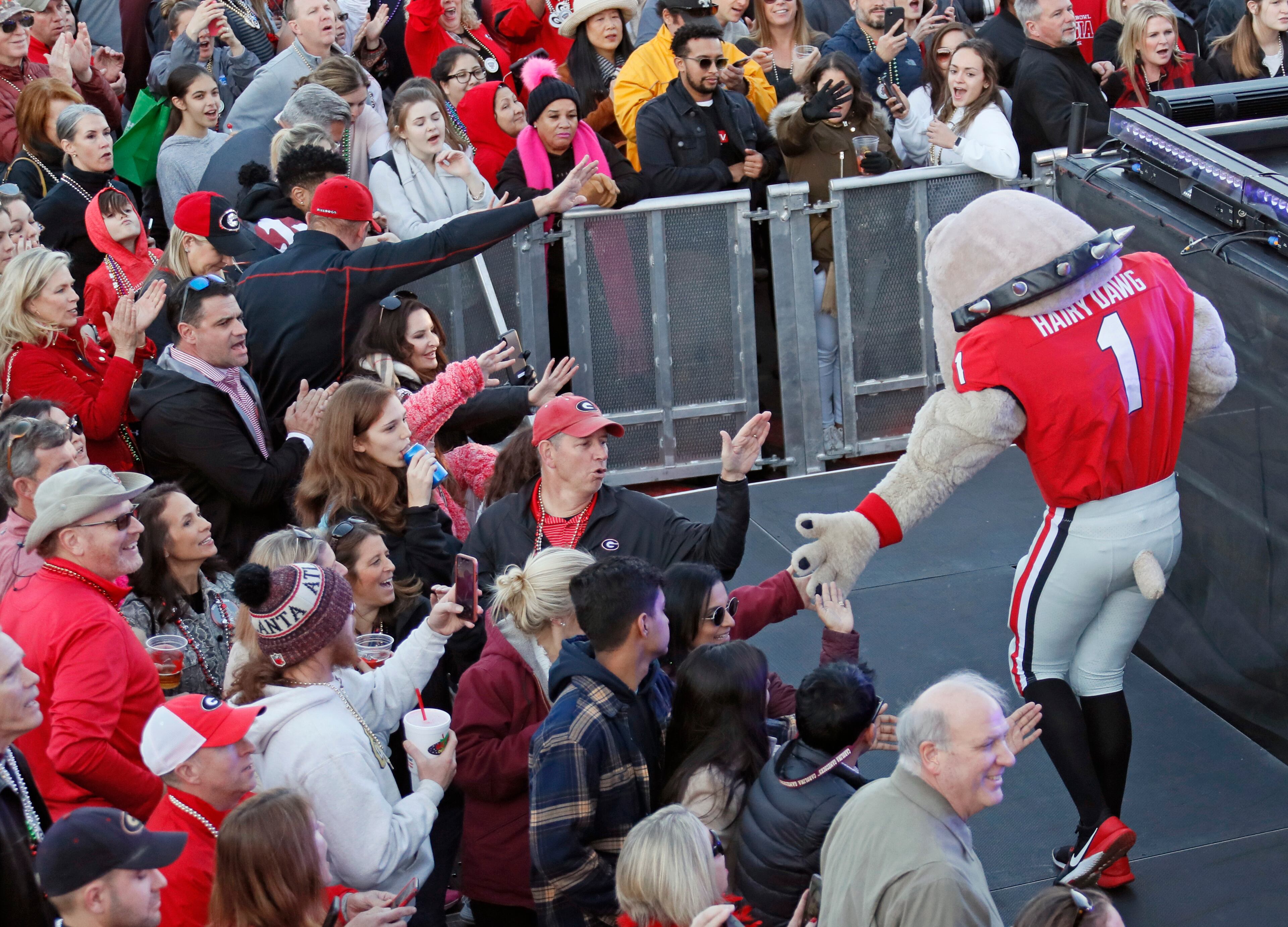 Hairy Dawg greets fans as the Georgia rally gets underway. A Georgia Pep Rally followed one for Baylor at the Allstate Fan Fest in the French Quarter Tuesday, December 31, 2019, in New Orleans. Bob Andres bandres@ajc.com