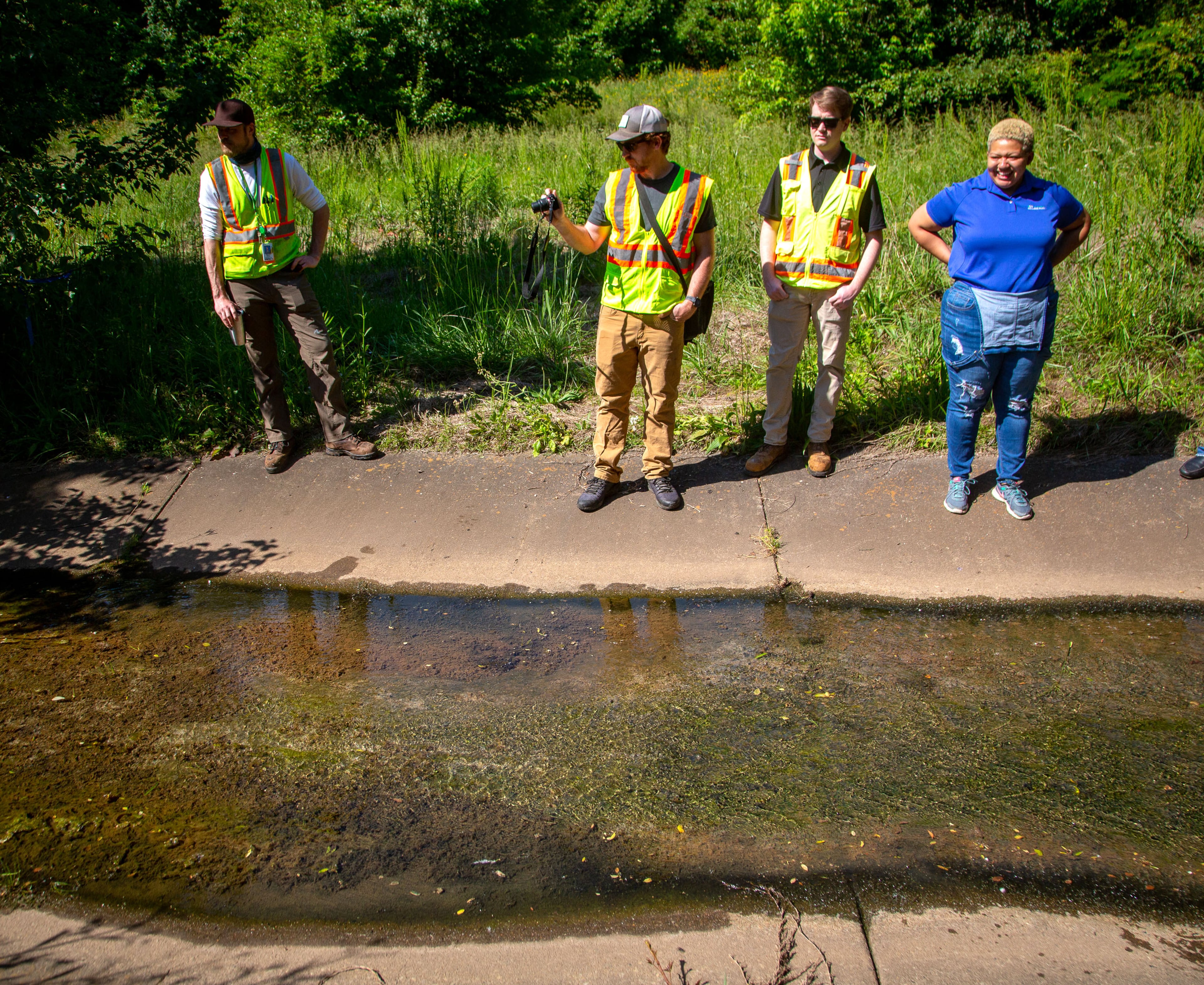 College Park officials look over the headwaters of the Flint River located on MARTA property near the College Park station. In late April 2021, MARTA agreed to sell the Willingham tract to College Park for $218,000 for the nature preserve and an outdoor classroom.. STEVE SCHAEFER FOR THE ATLANTA JOURNAL-CONSTITUTION