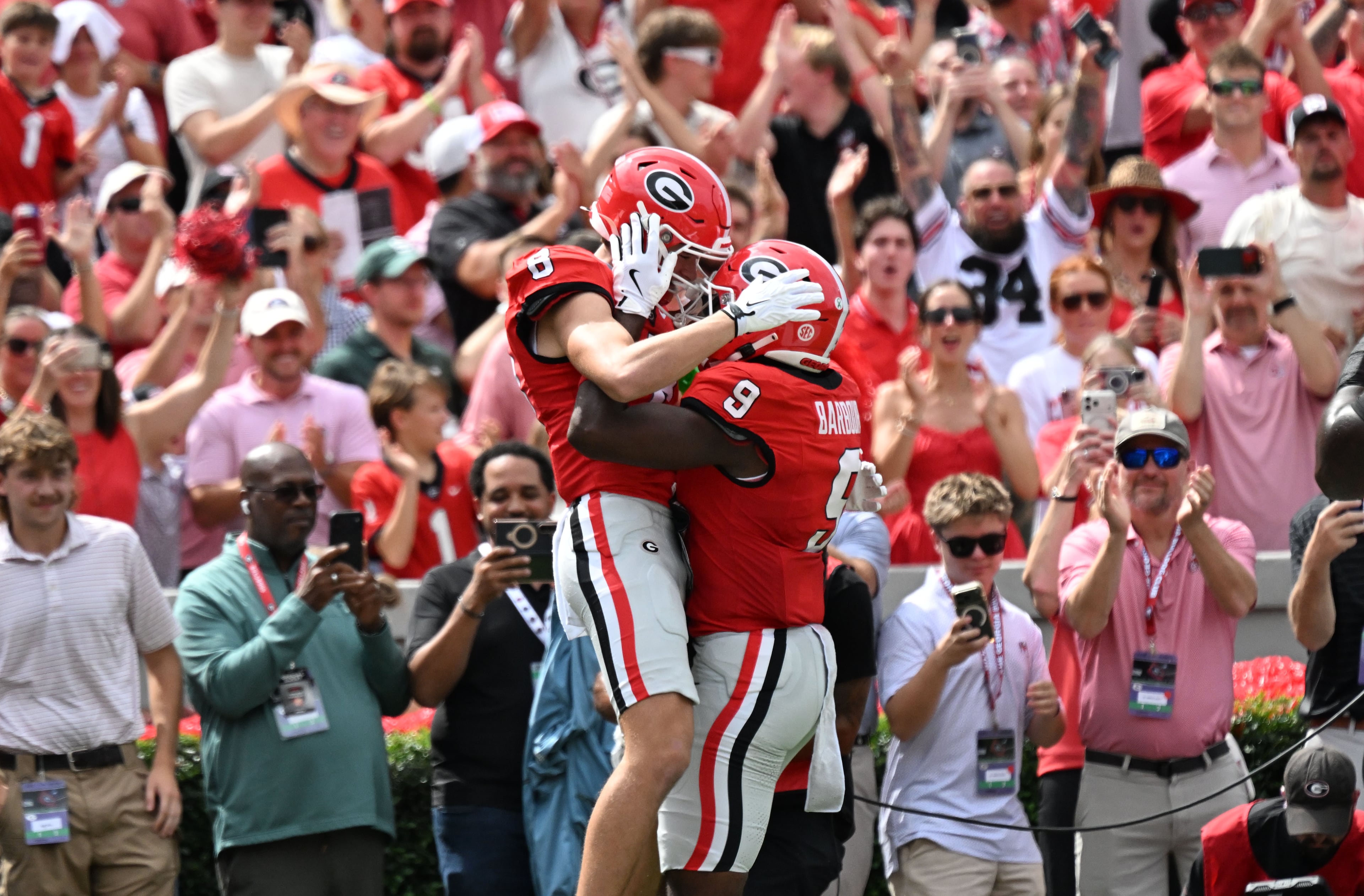 Georgia wide receiver Landon Roldan (8) celebrates with Georgia tight end Ethan Barbour (9) after scoring a touchdown during the first half in an NCAA football game at Sanford Stadium on Saturday, Oct. 3, 2026, in Athens. (Hyosub Shin/AJC)
