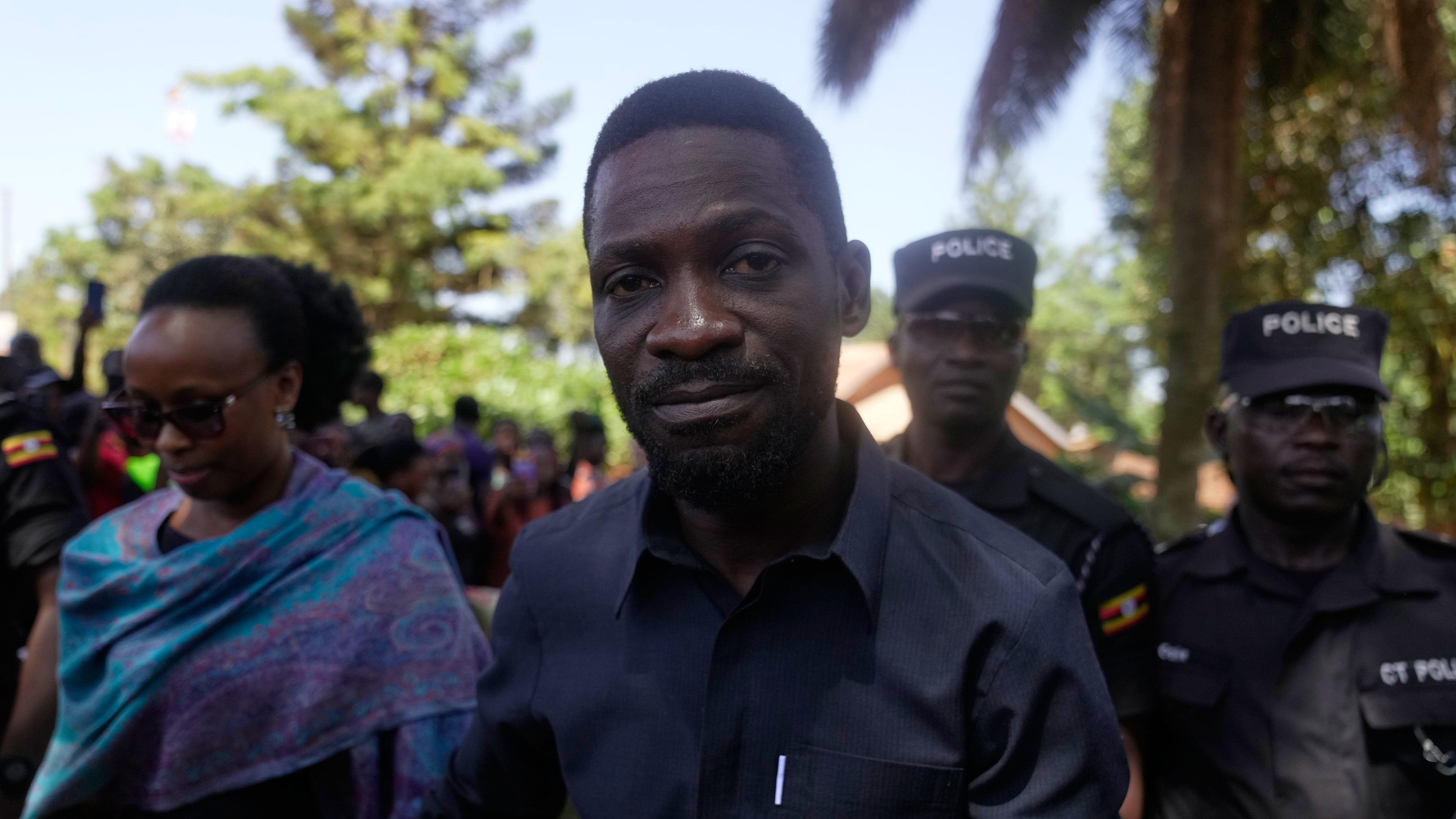 Uganda opposition presidential candidate Robert Kyagulanyi Ssentamu, famously known as Bobi Wine of the National Unity Platform (NUP), arrives with his wife to cast their votes, during the presidential election at a polling station, in Kampala, Uganda, Thursday, Jan. 15, 2026. (AP Photo/Brian Inganga)
