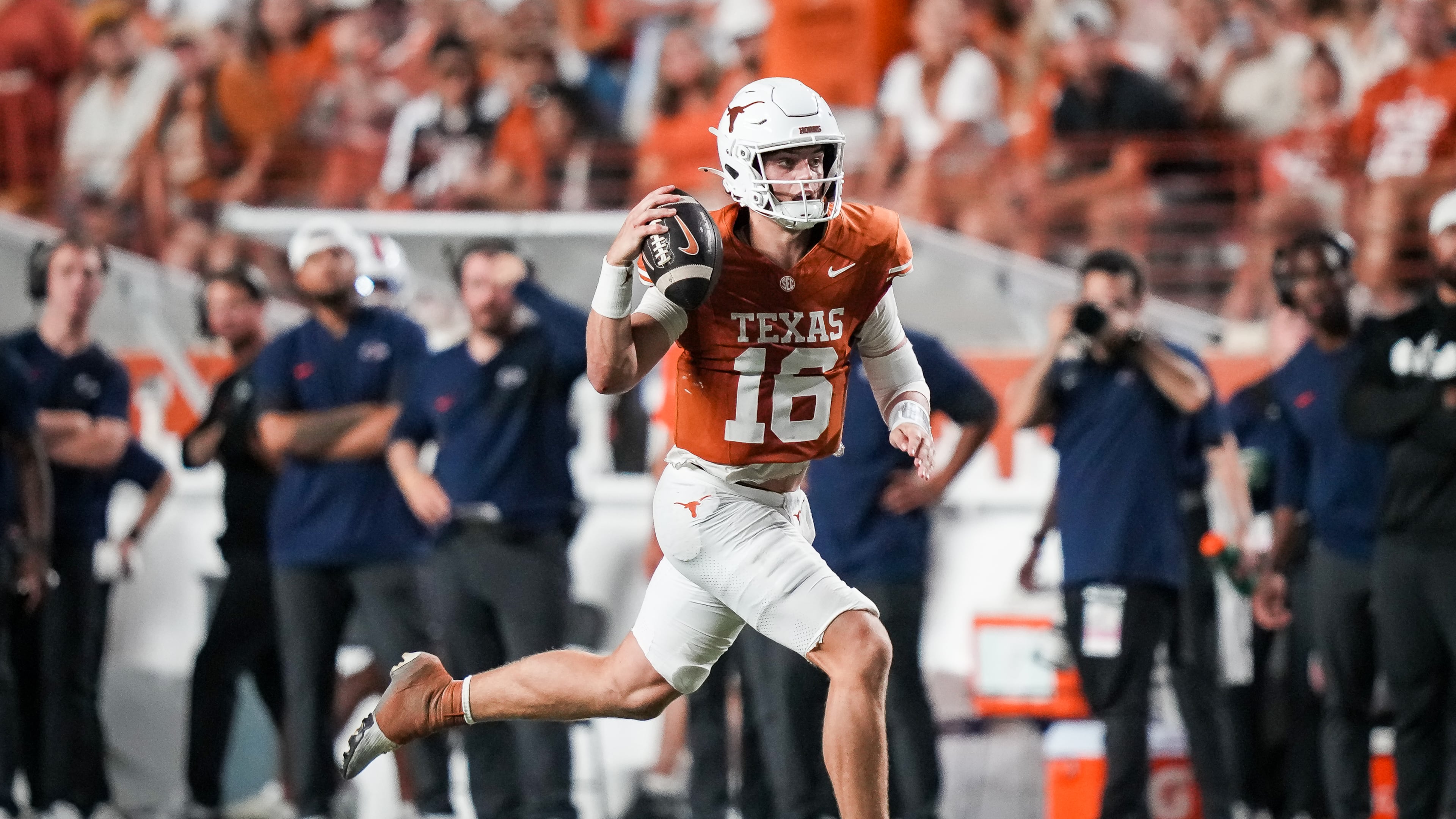 Texas Longhorns quarterback Arch Manning (16) runs the ball in the third quarter of the Longhorns' game against the UTSA Roadrunners at Royal-Memorial Stadium in Austin, Texas, Sept. 19, 2026. (Sara Diggins/The San Antonio Express-News via AP)