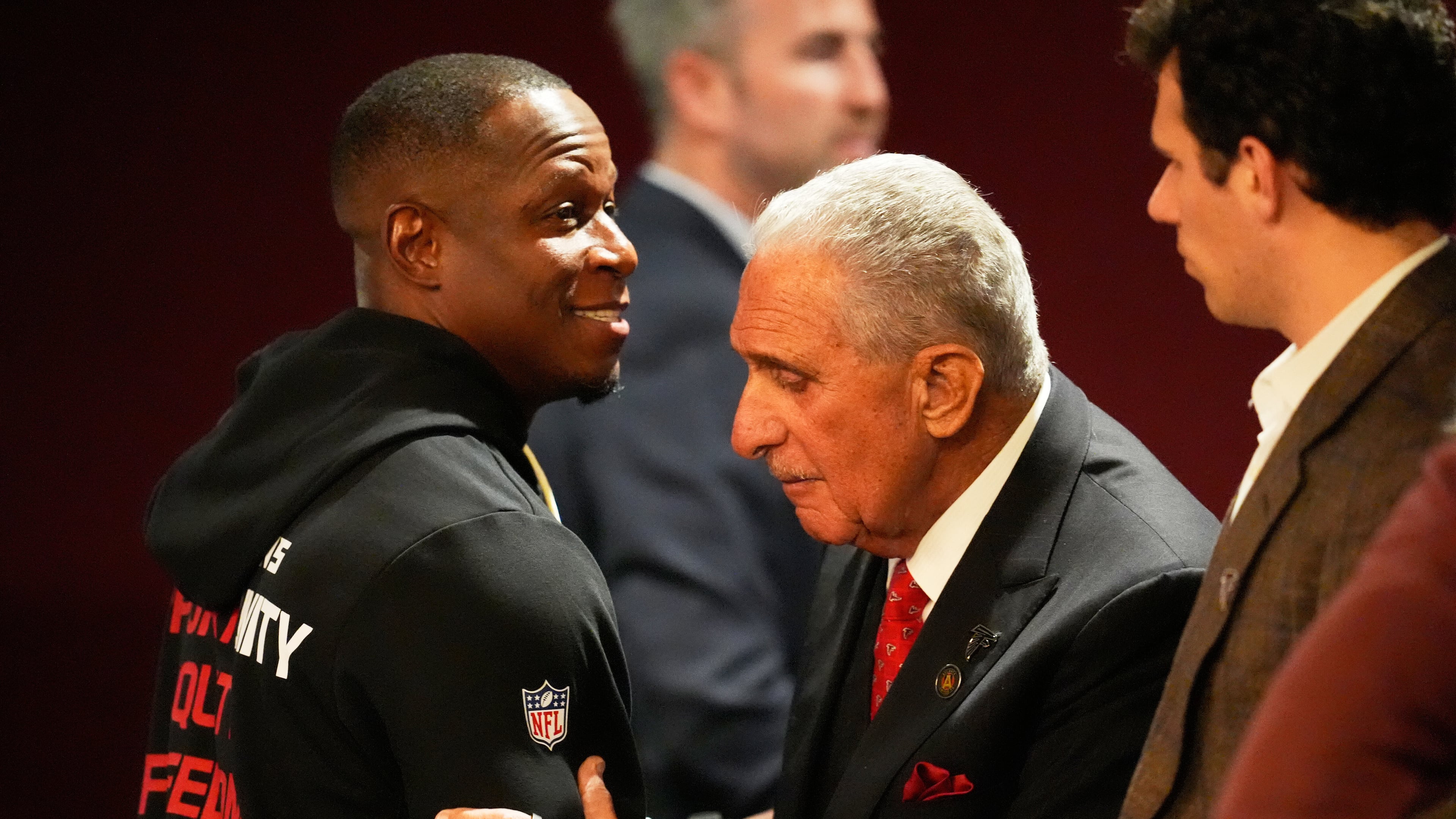 Atlanta Falcons owner Arthur Blank, right, hugs head coach Raheem Morris after an NFL football game against the New Orleans Saints, Sunday, Jan. 4, 2026, in Atlanta. (AP Photo/Mike Stewart)