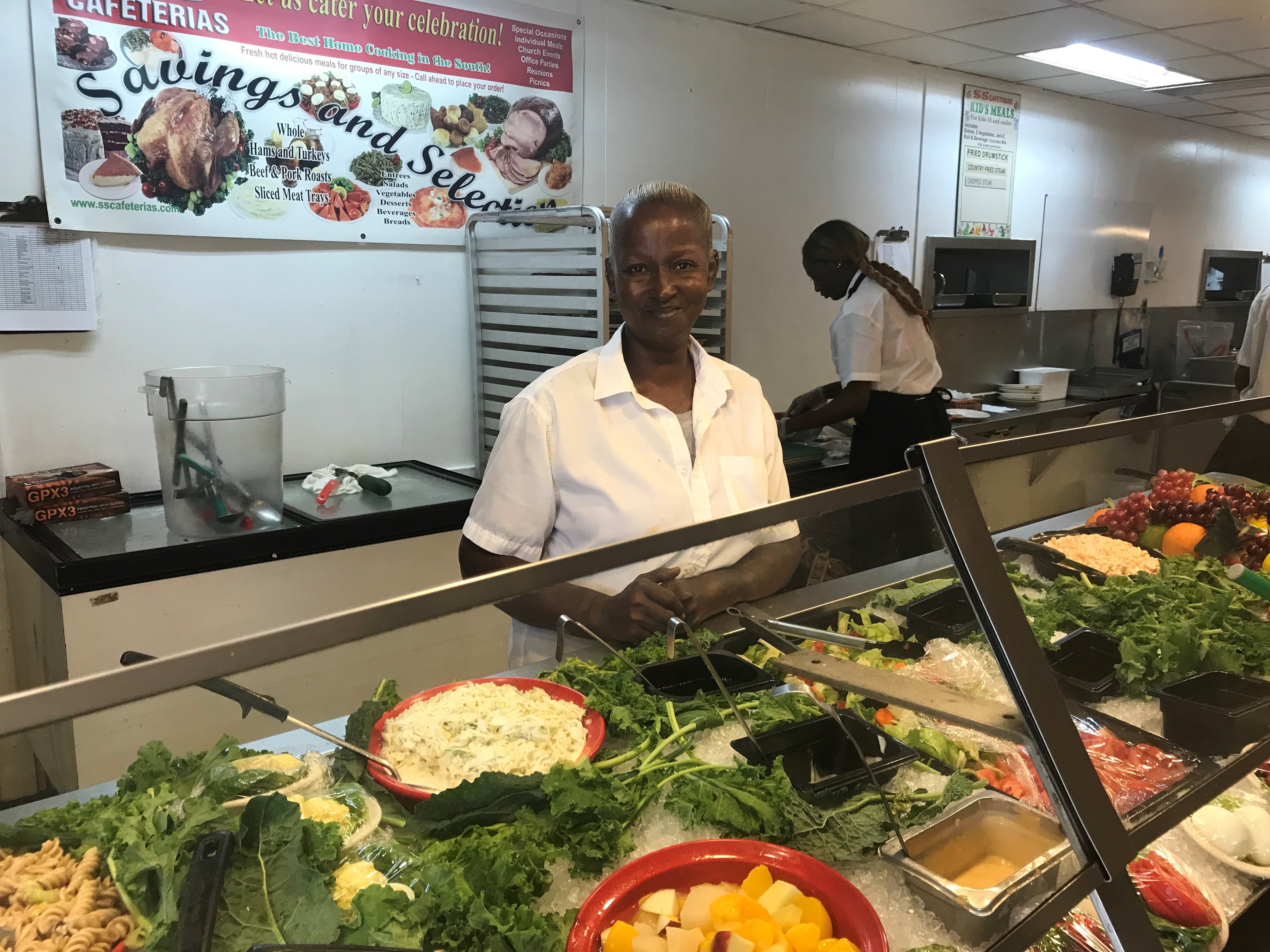 Angela Bailey works the salad bar at the S&S Cafeteria on Campbellton Road in southwest Atlanta Sept. 29, 2018. Bailey has been employed at the restaurant for the last nine years.