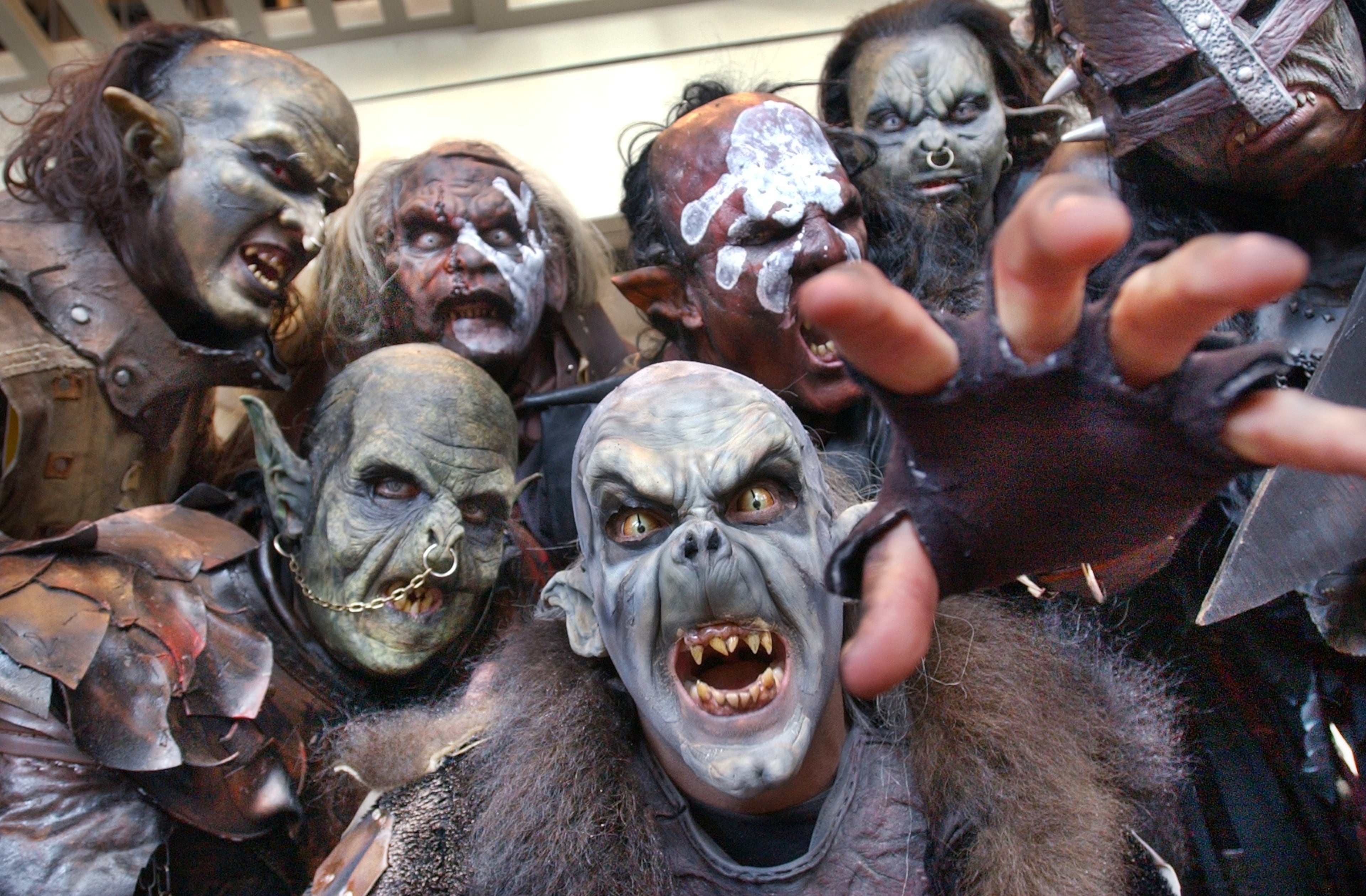 Orcs and Uruk-Hai characters from the "Lord of the Rings" movies could be found wandering the halls on the opening day of Dragon Con, the sci-fi convention held at the Hyatt Regency, on Aug. 29, 2003. This group consisted of costumers, actors, and make-up artists from Orlando and New York. Front and center is Brian Wolfe, who works in the Universal Studios prosthetics department. (Rich Addicks/AJC)