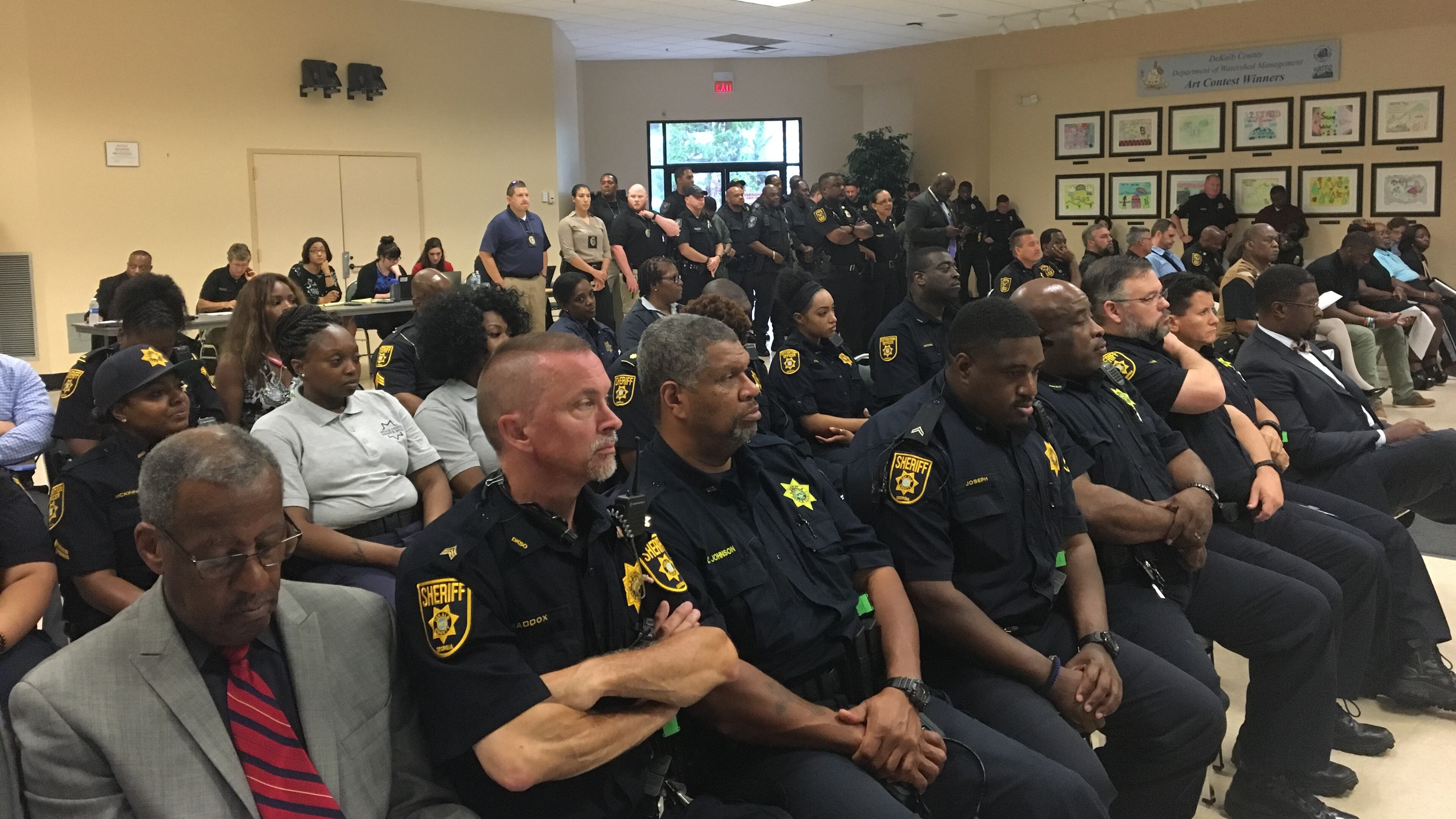 About 50 police officers and sheriff's deputies listened to DeKalb CEO Mike Thurmond's budget preview Tuesday at the Maloof Auditorium in Decatur. Thurmond said he'll address public safety pay disparities, which will result in raises for some officers. MARK NIESSE / MARK.NIESSE@AJC.COM