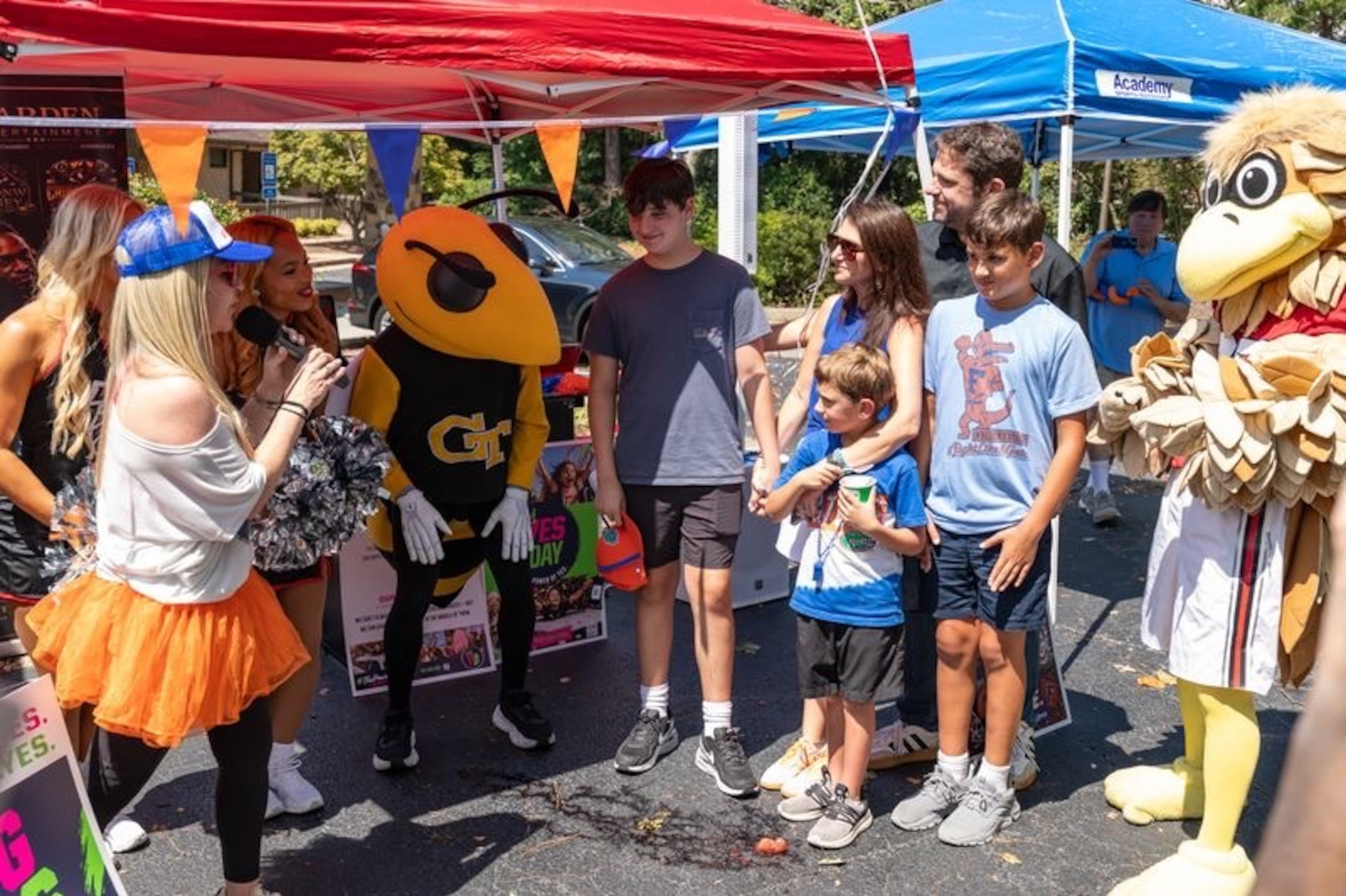 Jodi Sonenshine (left) addresses the Blick family during an event her group organized. Jodi started YES DAY because there are some things you simply cannot fix for a child. (Courtesy of Steven Dewberry)