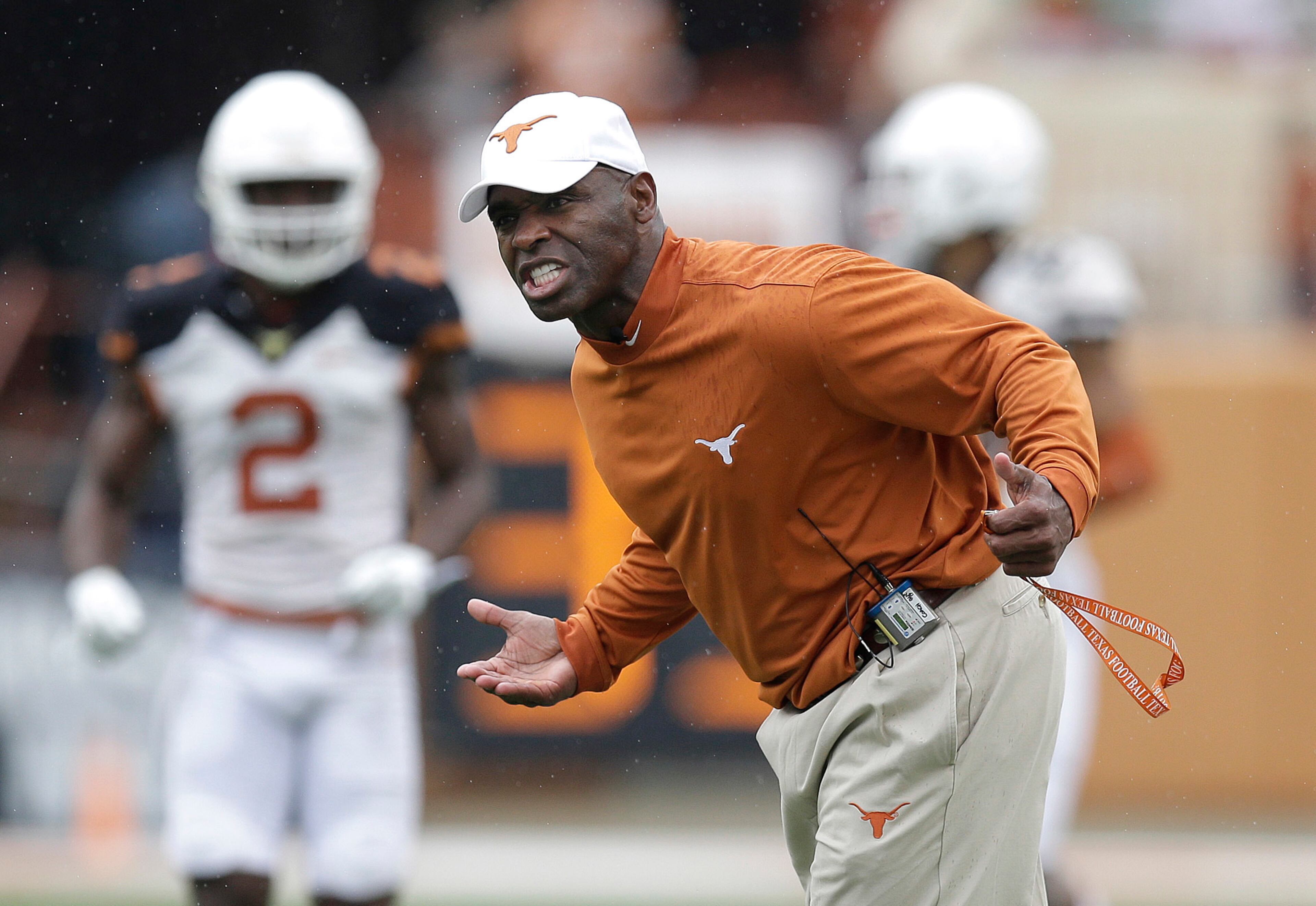 Texas head coach Charlie Strong talks to his players during a spring NCAA college football game, Saturday, April 16, 2016, in Austin, Texas. (AP Photo/Eric Gay)