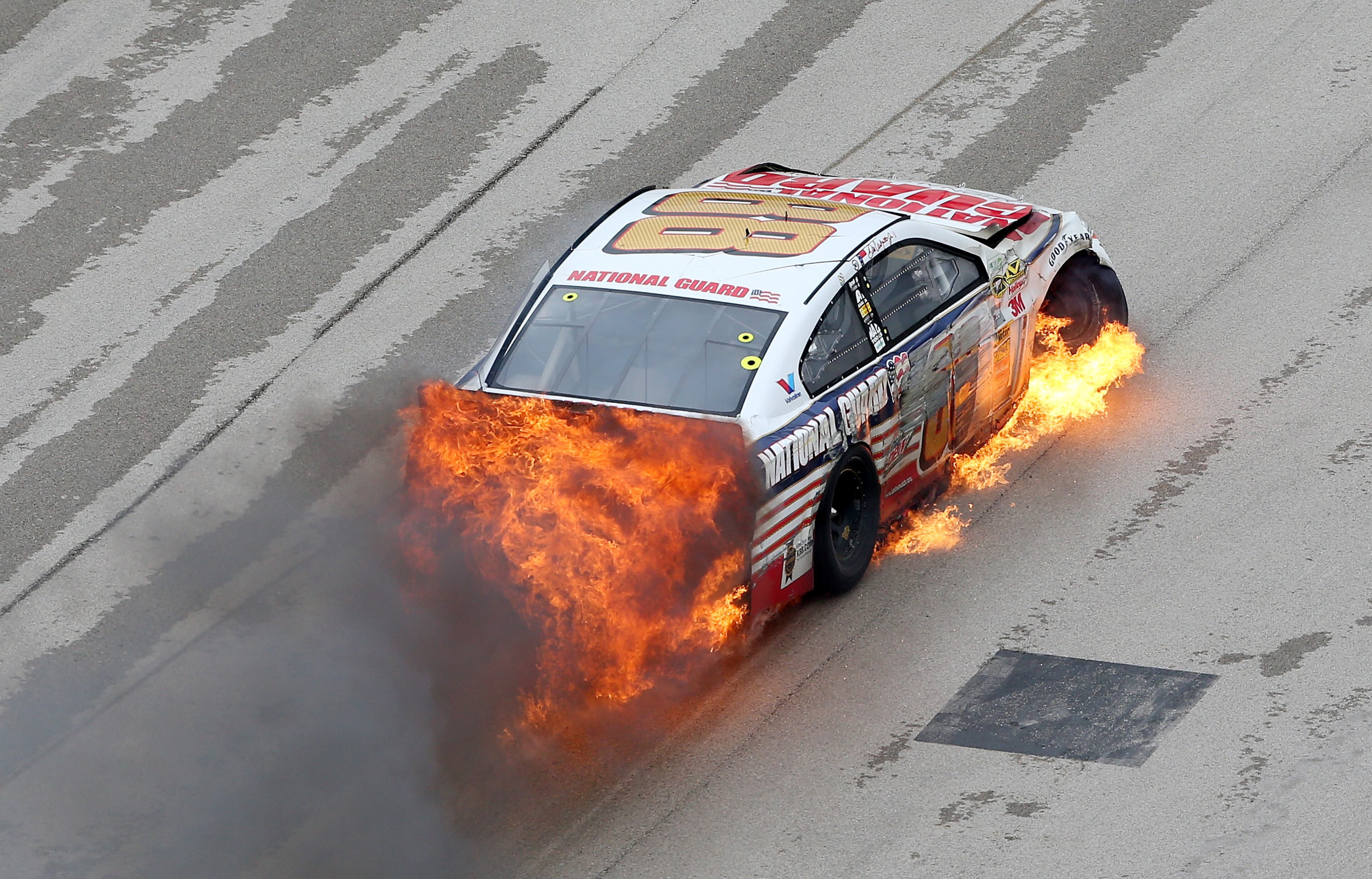 Dale Earnhardt Jr., driver of the #88 National Guard Chevrolet, crashes early in the NASCAR Sprint Cup Series Duck Commander 500 at Texas Motor Speedway on April 7, 2014 in Fort Worth, Texas. (Photo by Nick Laham/Getty Images for Texas Motor Speedway)