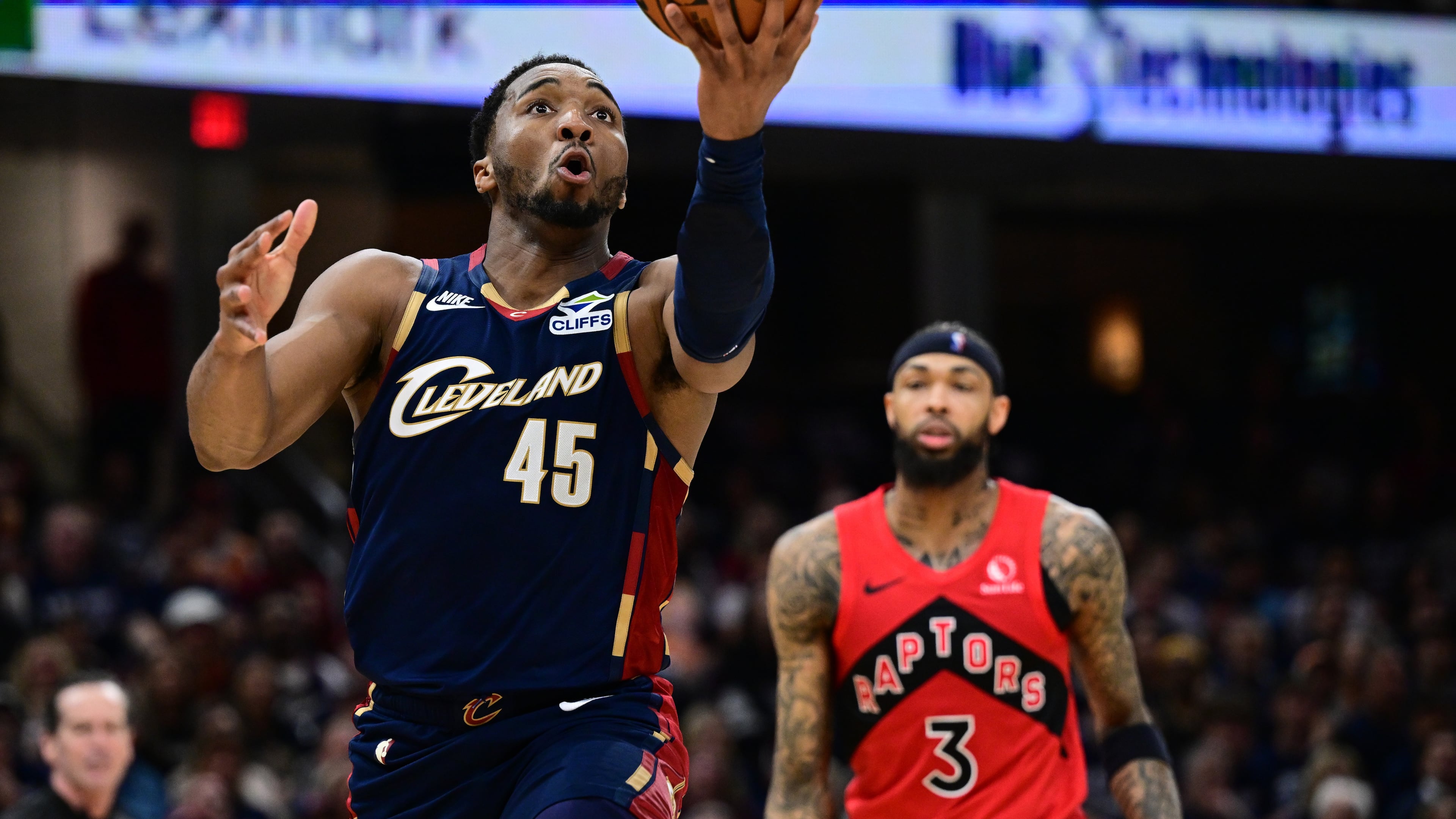 Cleveland Cavaliers guard Donovan Mitchell goes to the basket against the Toronto Raptors during the second half in Game 1 of a first-round NBA playoffs basketball series, Saturday, April 18, 2026, In Cleveland. (AP Photo/David Dermer)