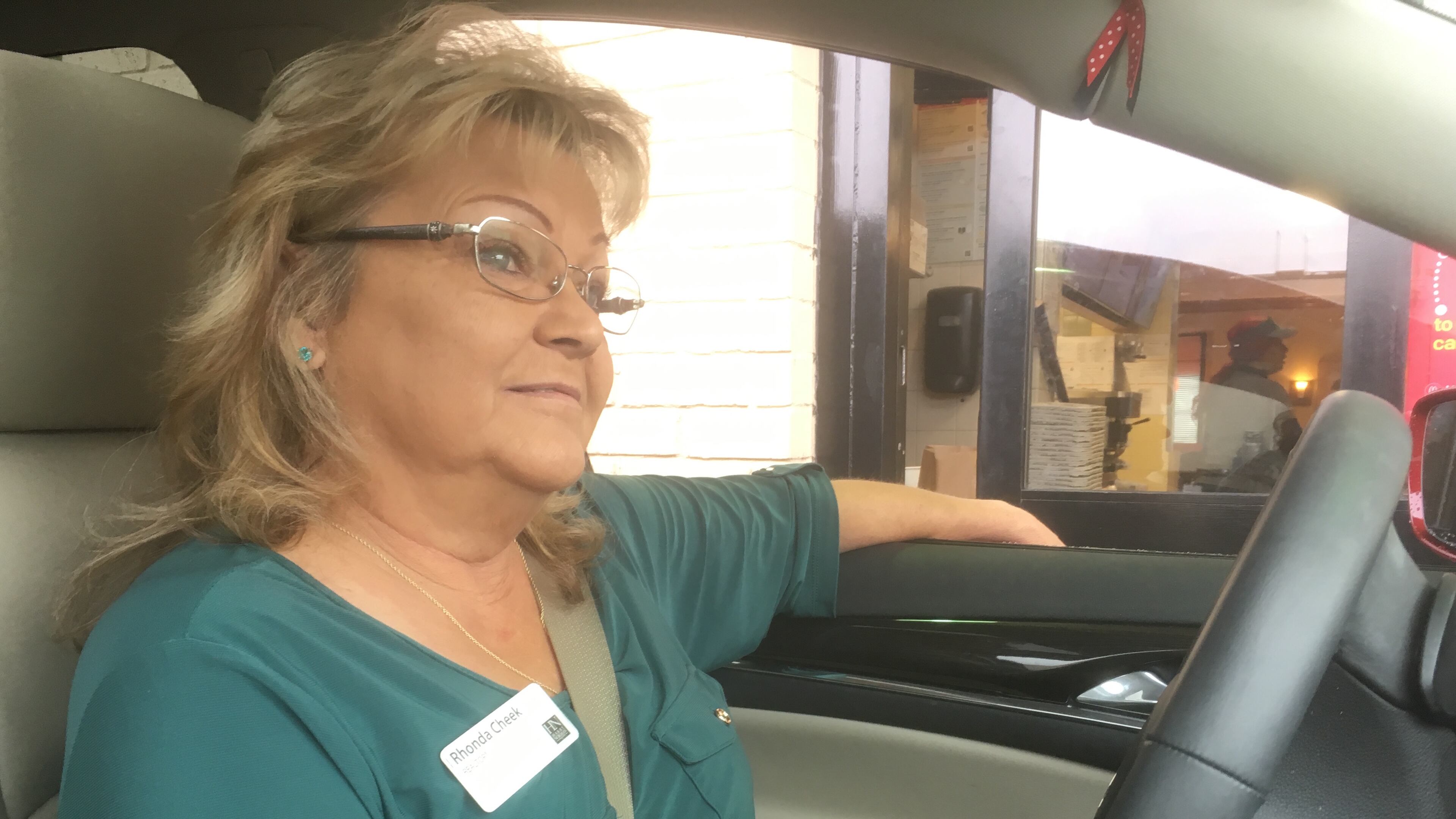 Rhonda Cheek awaits her usual breakfast order of oatmeal and a Coke in the drive-thru line. Photo: Jennifer Brett