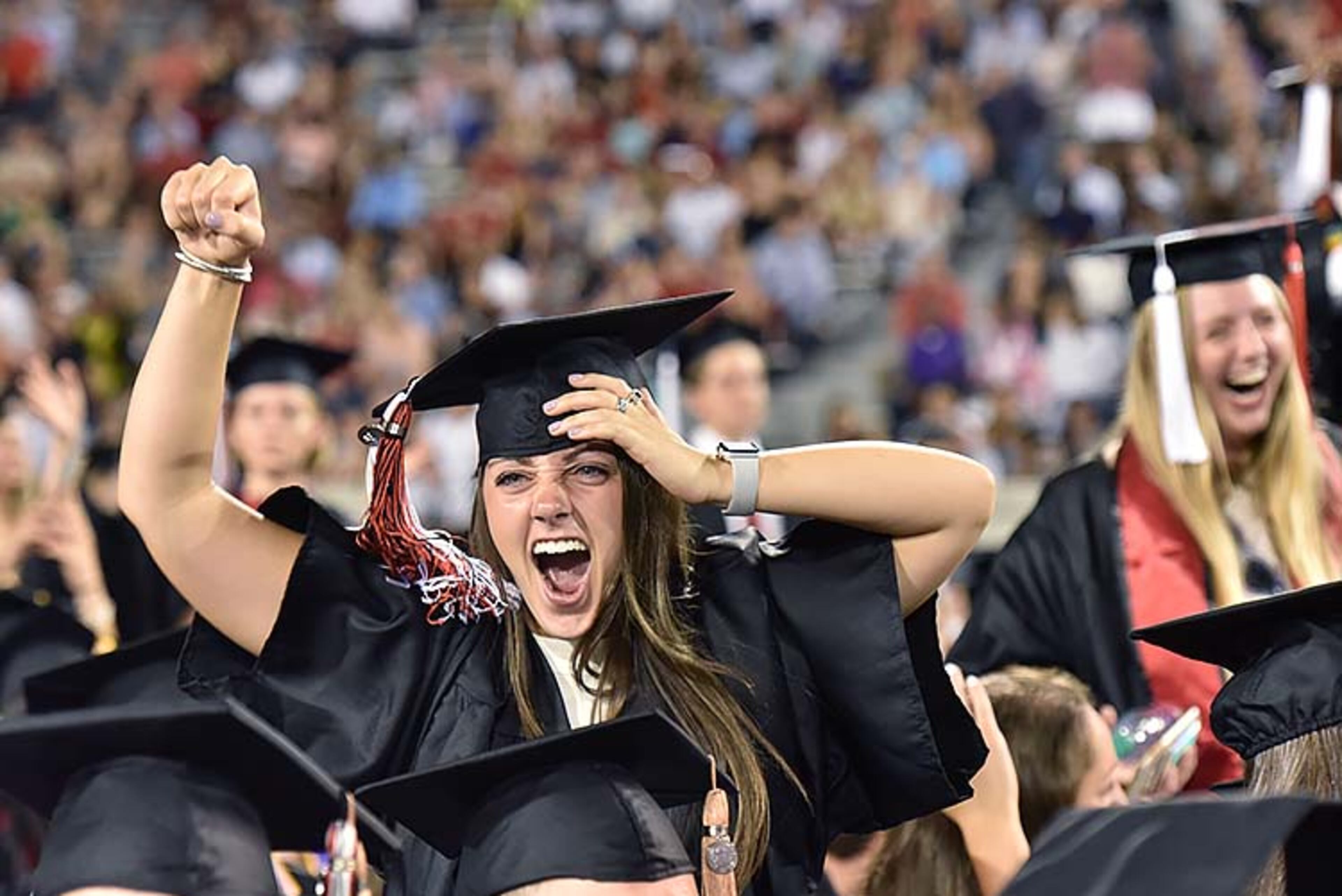 May 10, 2019 Athens - Students react as they move their tassels during UGA's 2019 spring undergraduate commencement ceremony at Sanford Stadium in Athens on Friday, May 10, 2019. HYOSUB SHIN / HSHIN@AJC.COM