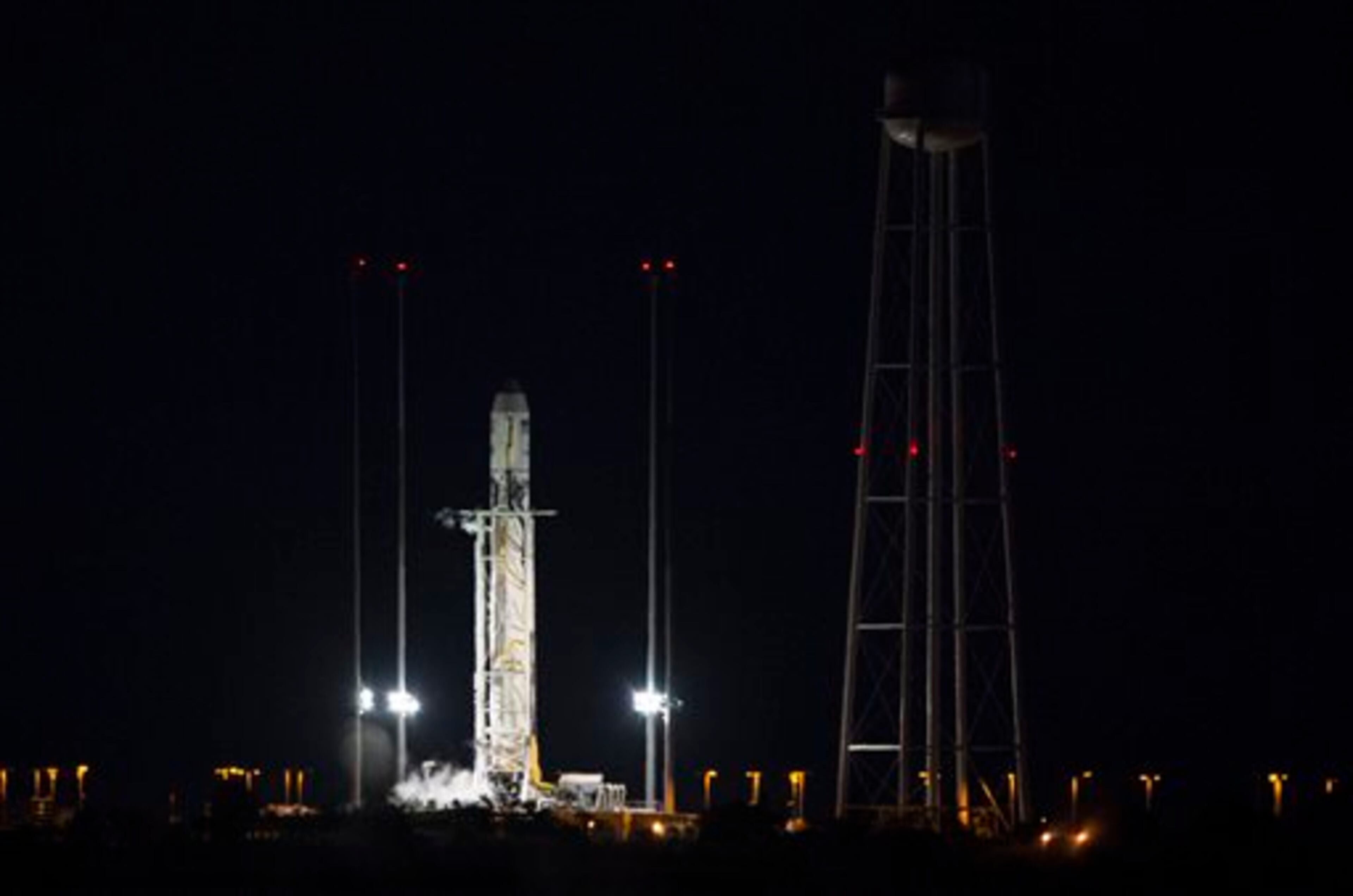 This image provided by NASA shows the Orbital Sciences Corporation Antares rocket, with the Cygnus spacecraft onboard, on launch Pad-0A after the launch attempt was scrubbed because of a boat down range in the trajectory Antares would have flown had it lifted off, Monday, Oct. 27, 2014, at NASA's Wallops Flight Facility in Wallops Island, Va. The Antares will launch with the Cygnus spacecraft filled with over 5,000 pounds of supplies for the International Space Station, including science experiments, experiment hardware, spare parts, and crew provisions. The Orbital-3 mission is Orbital Sciences' third contracted cargo delivery flight to the space station for NASA. The next launch attempt will be made on Tuesday. (AP Photo/NASA, Joel Kowsky)