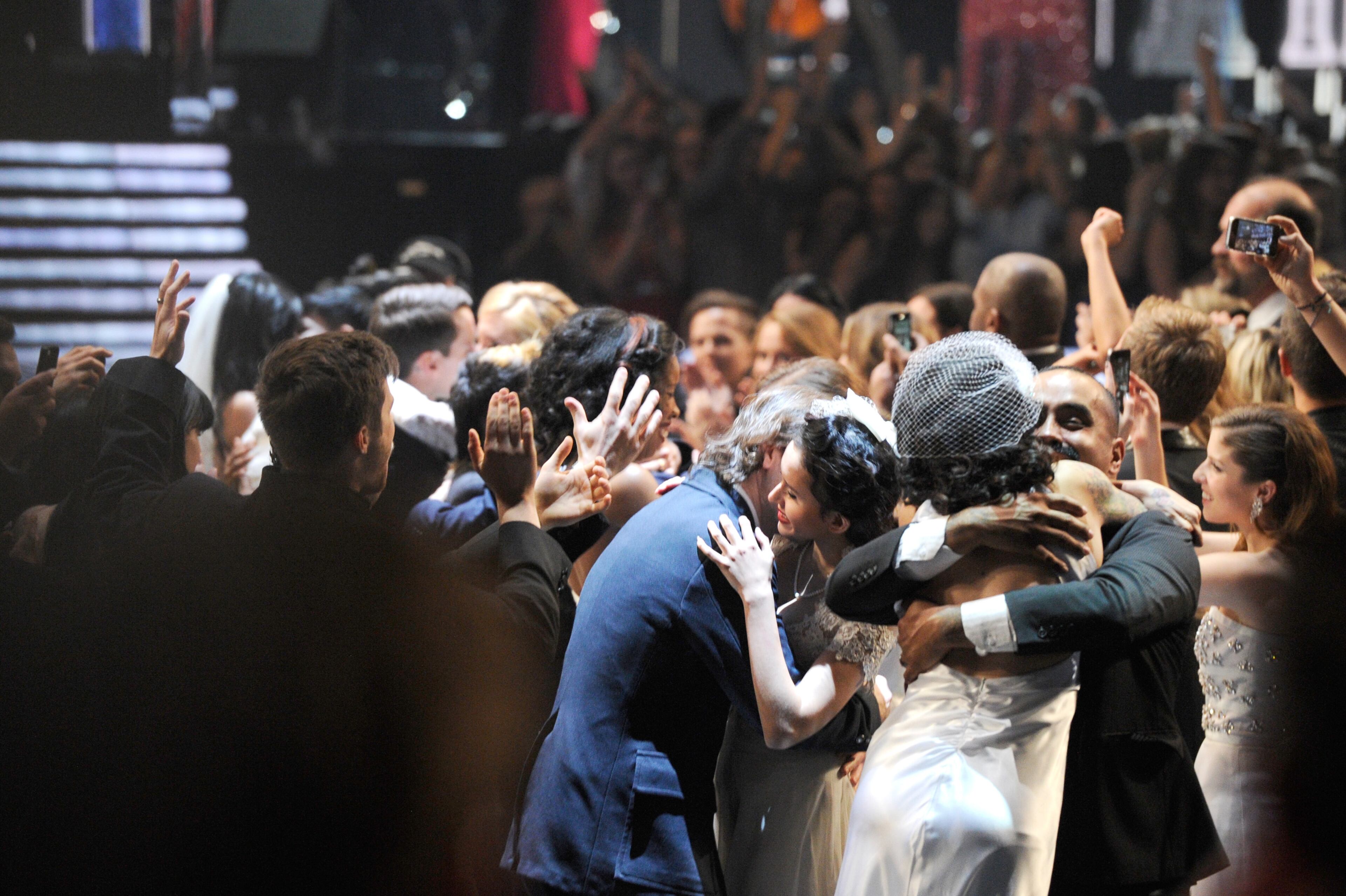 LOS ANGELES, CA - JANUARY 26: Couples are wed during the Macklemore and Ryan Lewis performance during the 56th GRAMMY Awards at Staples Center on January 26, 2014 in Los Angeles, California. (Photo by Kevork Djansezian/Getty Images)