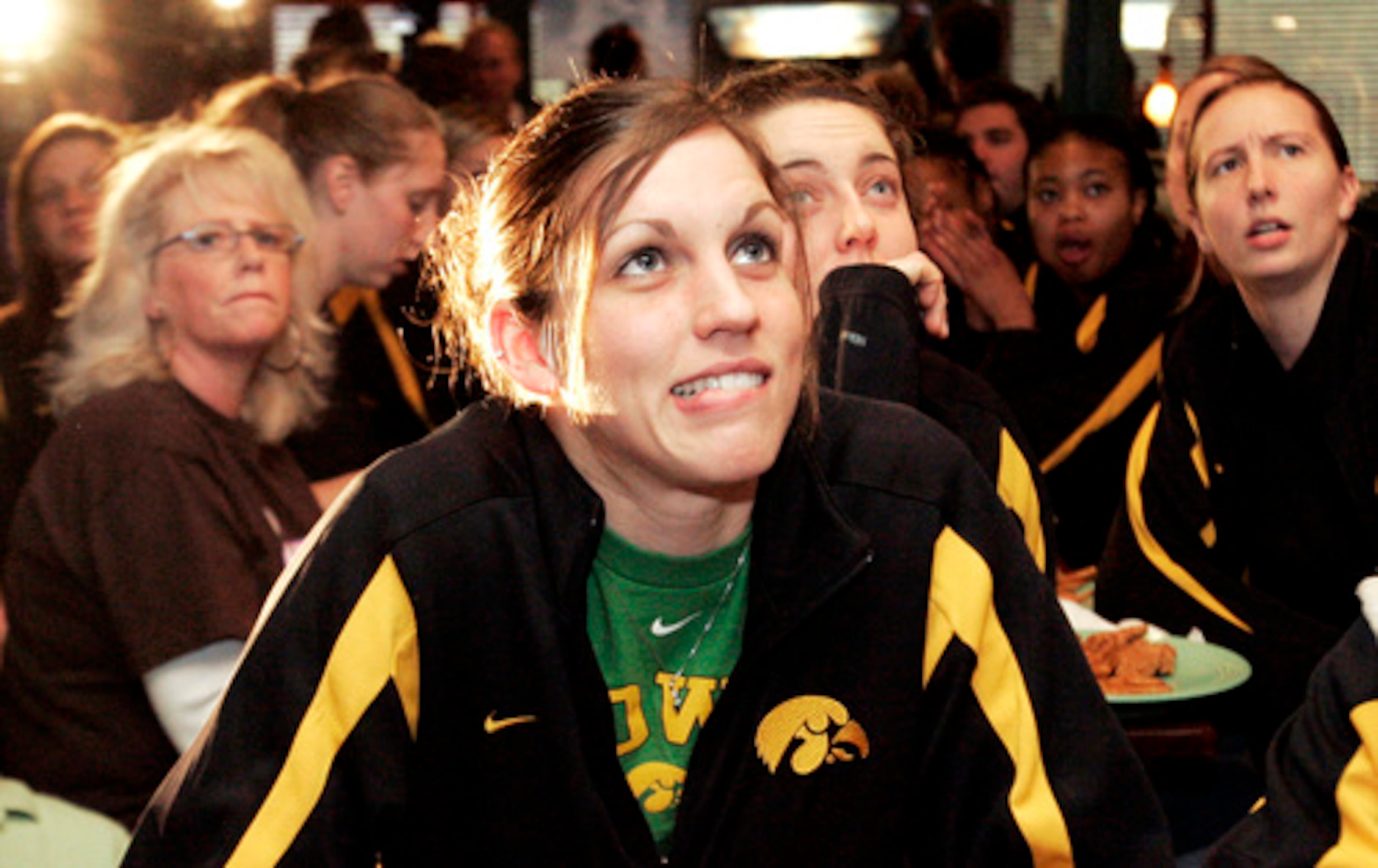 On Monday in Iowa City, Iowa, Hawkeyes basketball player Wendy Ausdemore waits with her teammates for the NCAA women's basketball tournament announcement. They will will play the UGA Lady Bulldogs in the first round.