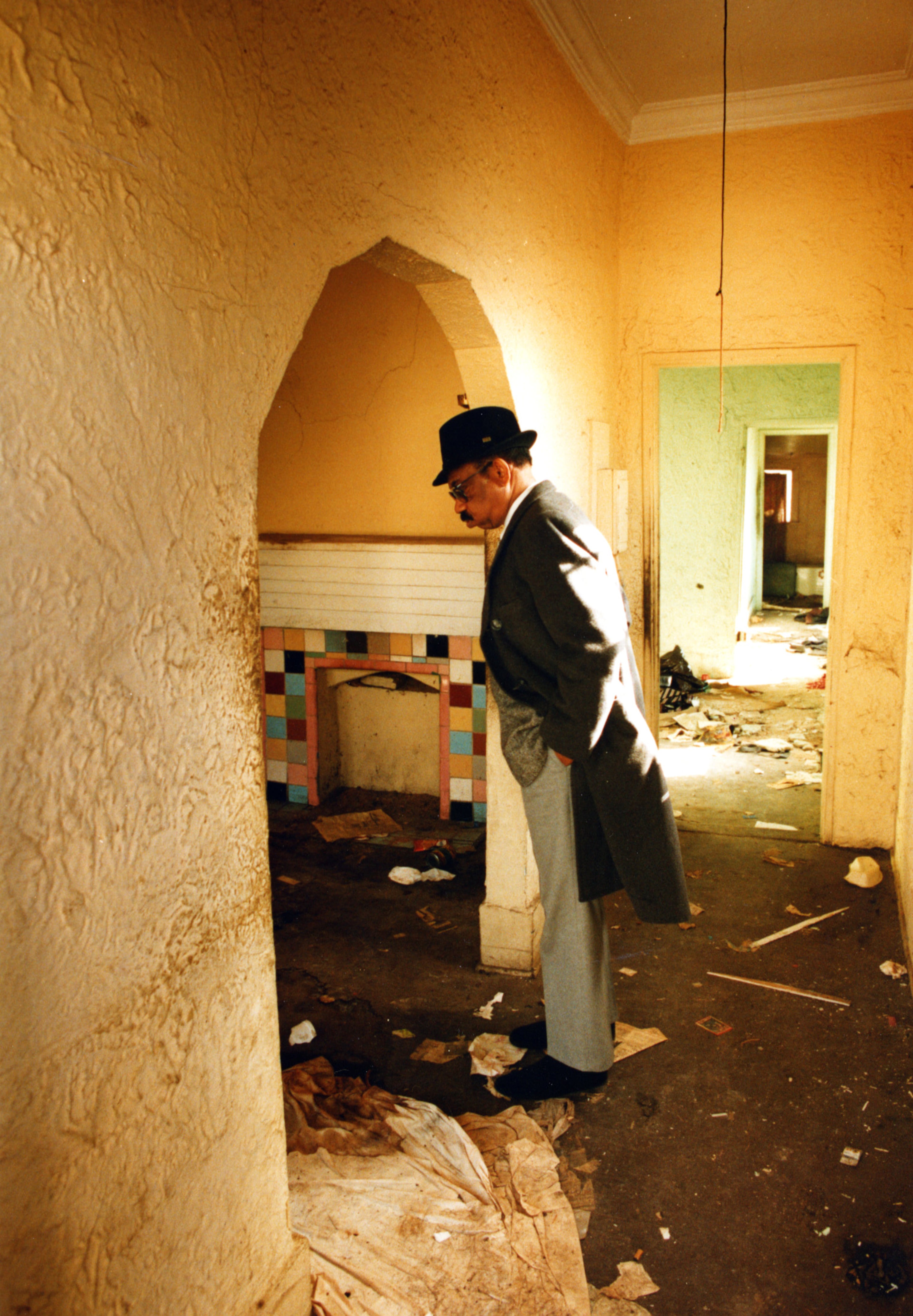 Herman Russell gets emotional as he tours his childhood home in the Summerhill neighborhood, upset at the current state of the house in 1993. He gave the house to the church down the street.