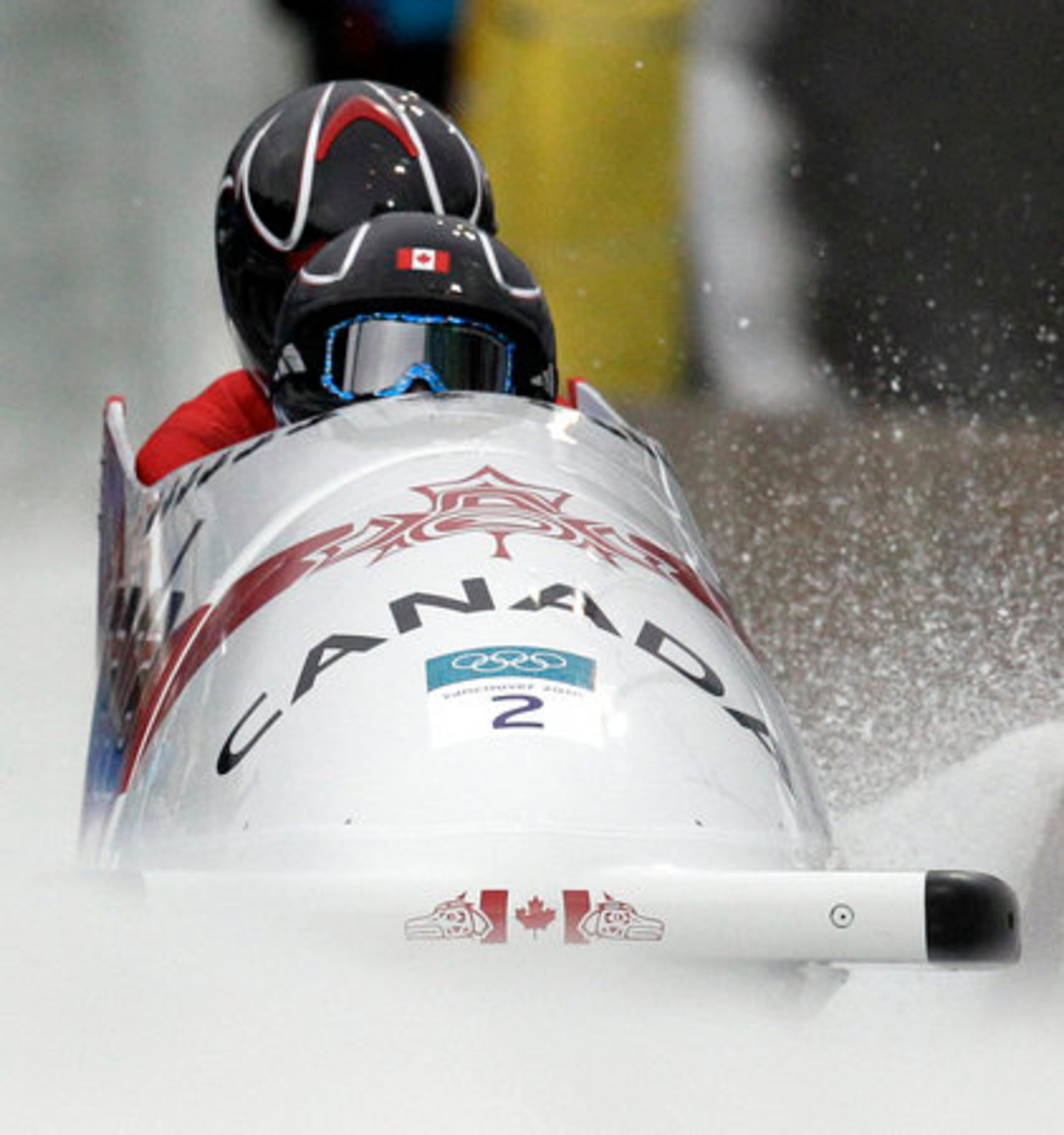 Canada's CAN-1, piloted by Kaillie Humphries, front, with brakeman Heather Moyse, competes during the women's two-man.