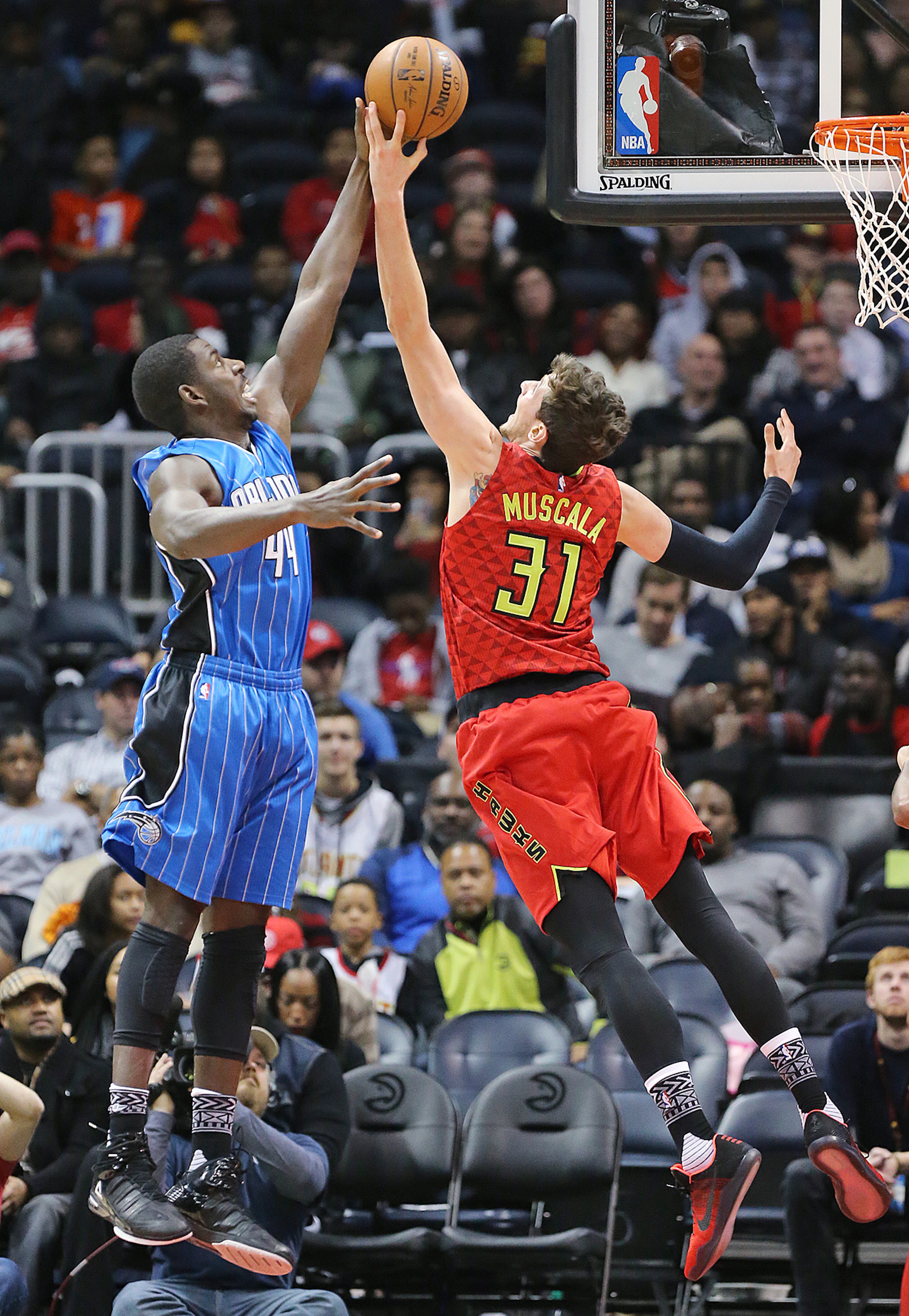 Hawks Mike Muscala blocks a shot by Magic Andrew Nicholson during the MLK Day basketball game on Monday, Jan. 18, 2016, in Atlanta. The Hawks rolled to a 98-81 victory over the Magic.