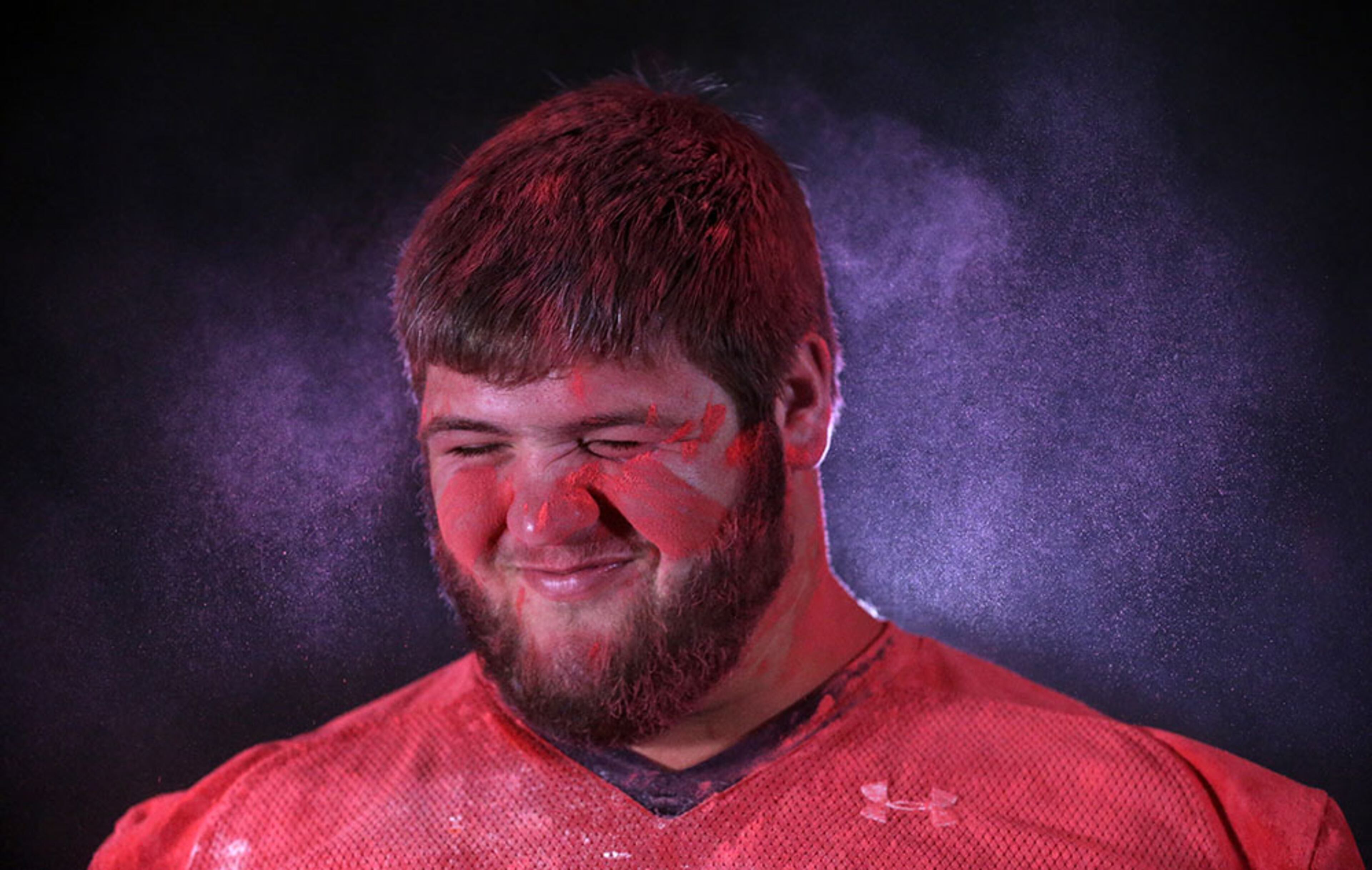 Stephens County offensive lineman Ben Cleveland shakes off some the dust he collected during the shoot of his AJC Super 11 portrait.