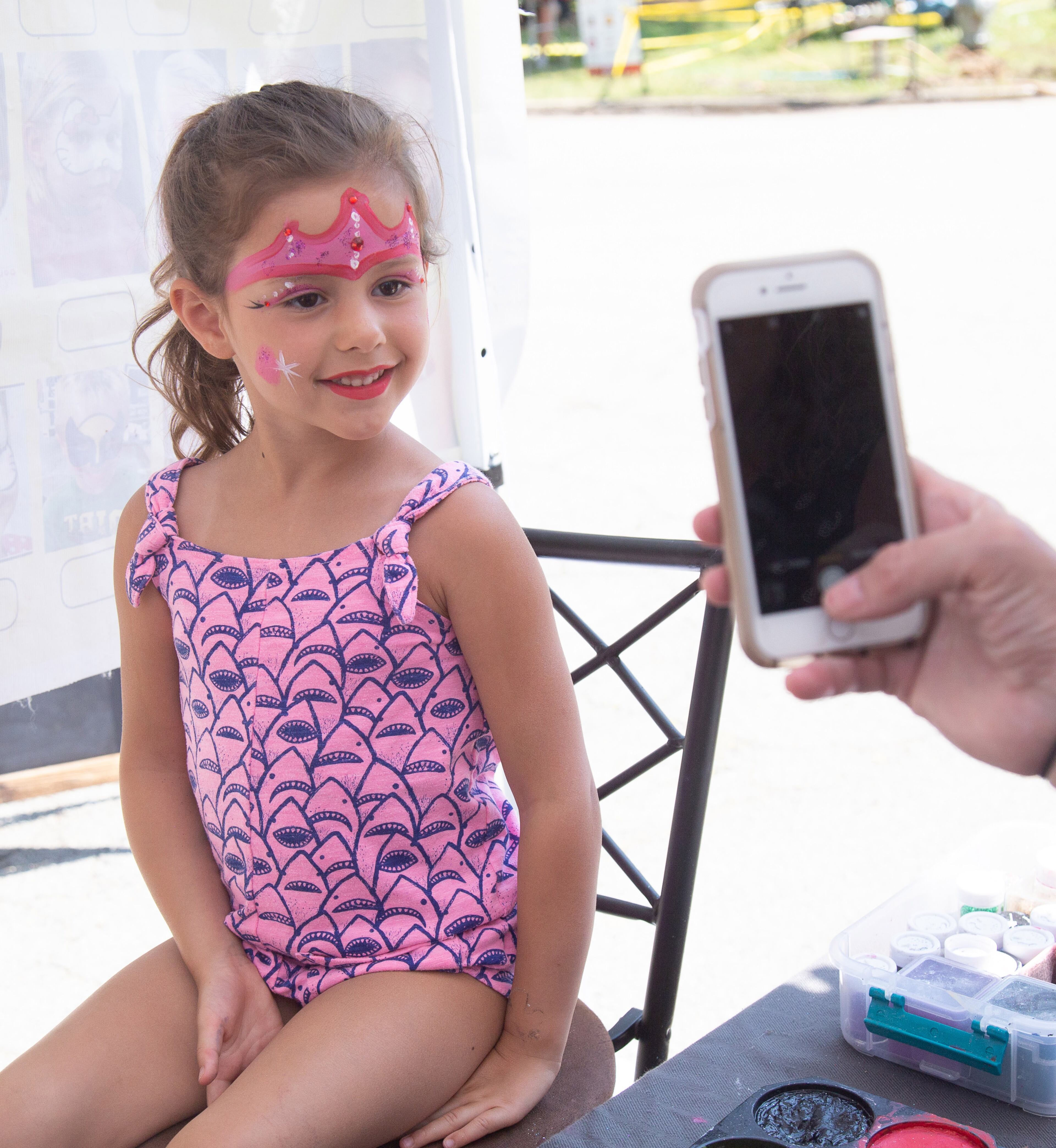 Baylen Bealey gets a photograph taken after Sane Sapaia finishes with her face painting during the 20th annual Lemonade Days Festival on Sunday, April 28, 2019, in Dunwoody. Lemonade Days is the largest annual fundraising event for Dunwoody Preservation Trust. All proceeds are used within the community for historic preservation and education. STEVE SCHAEFER / SPECIAL TO THE AJC