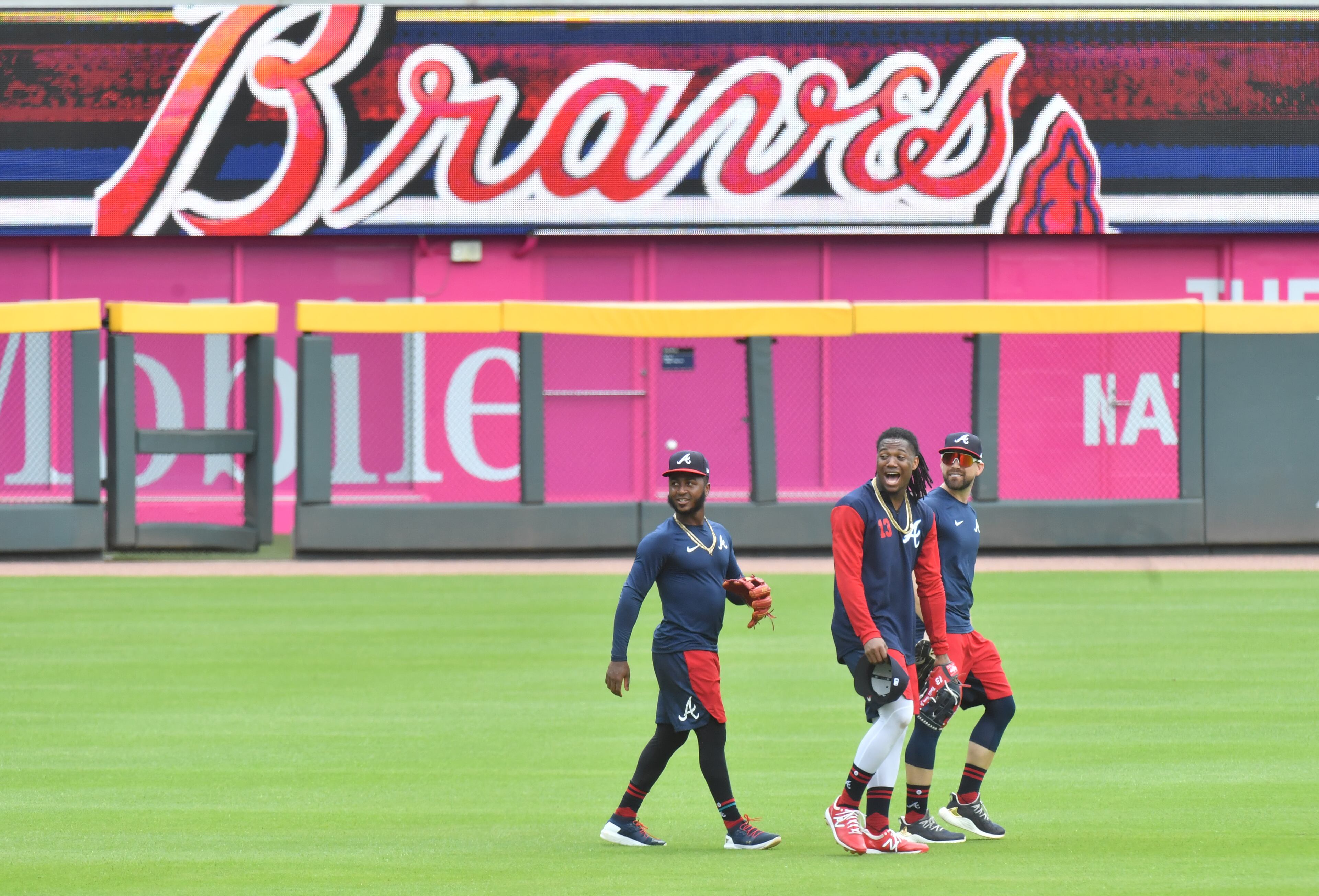 Braves second baseman Ozzie Albies (left), outfielder Ronald Acuna Jr. (middle) and outfielder Ender Inciarte cross the field. (Hyosub Shin / Hyosub.Shin@ajc.com)