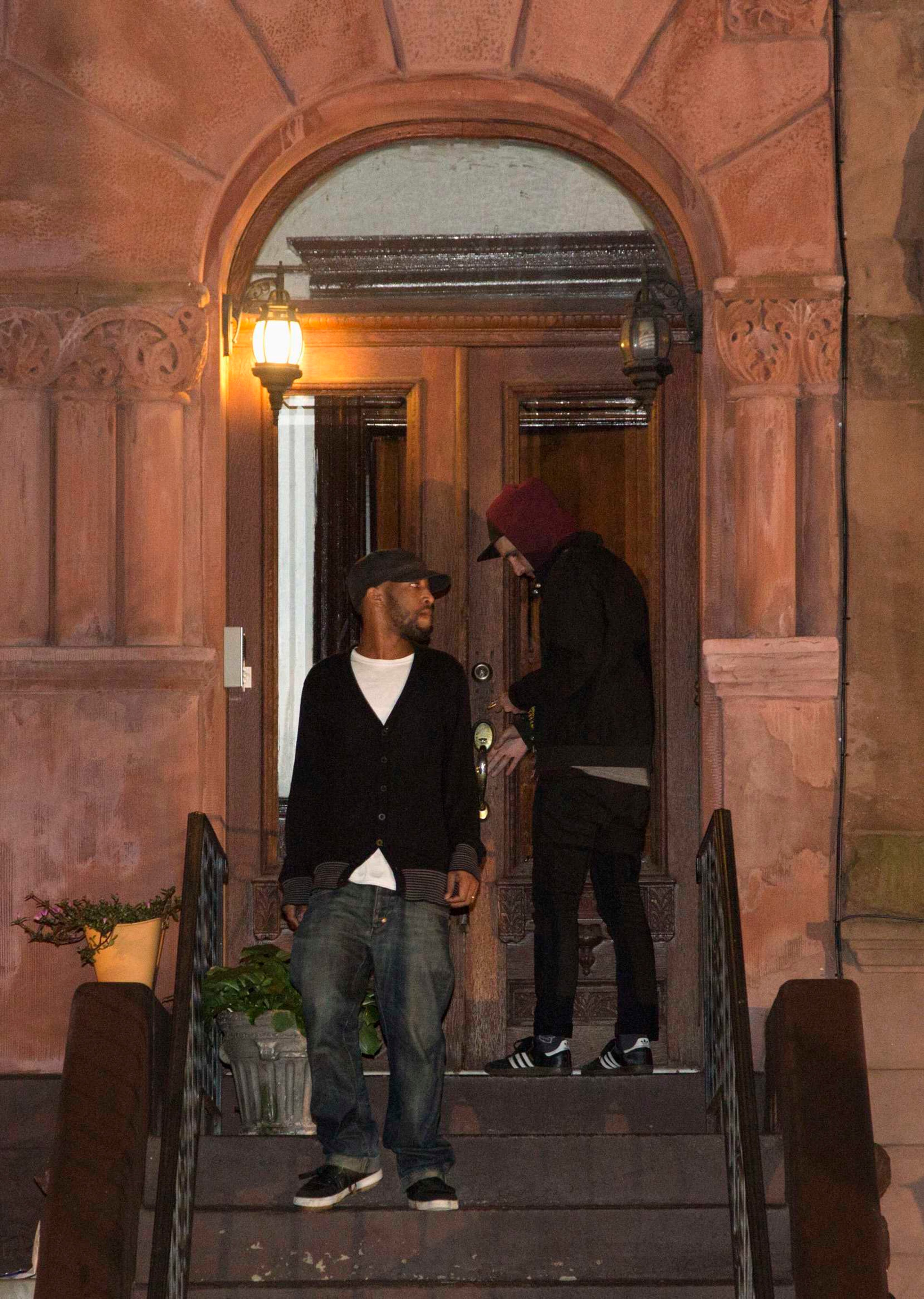 Anthony Little, brother in-law of suspected Washington Navy Yard shooter Aaron Alexis, walks down the steps of the Brooklyn residence of Cathleen Alexis, mother of Aaron, in New York September 16, 2013. A U.S. military veteran opened fire at the Washington Navy Yard on Monday in a burst of violence that killed 13 people, including the gunman, and set off waves of panic at the military installation just miles from the White House and U.S. Capitol. The FBI identified the suspect as Aaron Alexis, 34, of Fort Worth, Texas, a Navy contractor who had two gun-related brushes with the law. REUTERS/Andrew Kelly