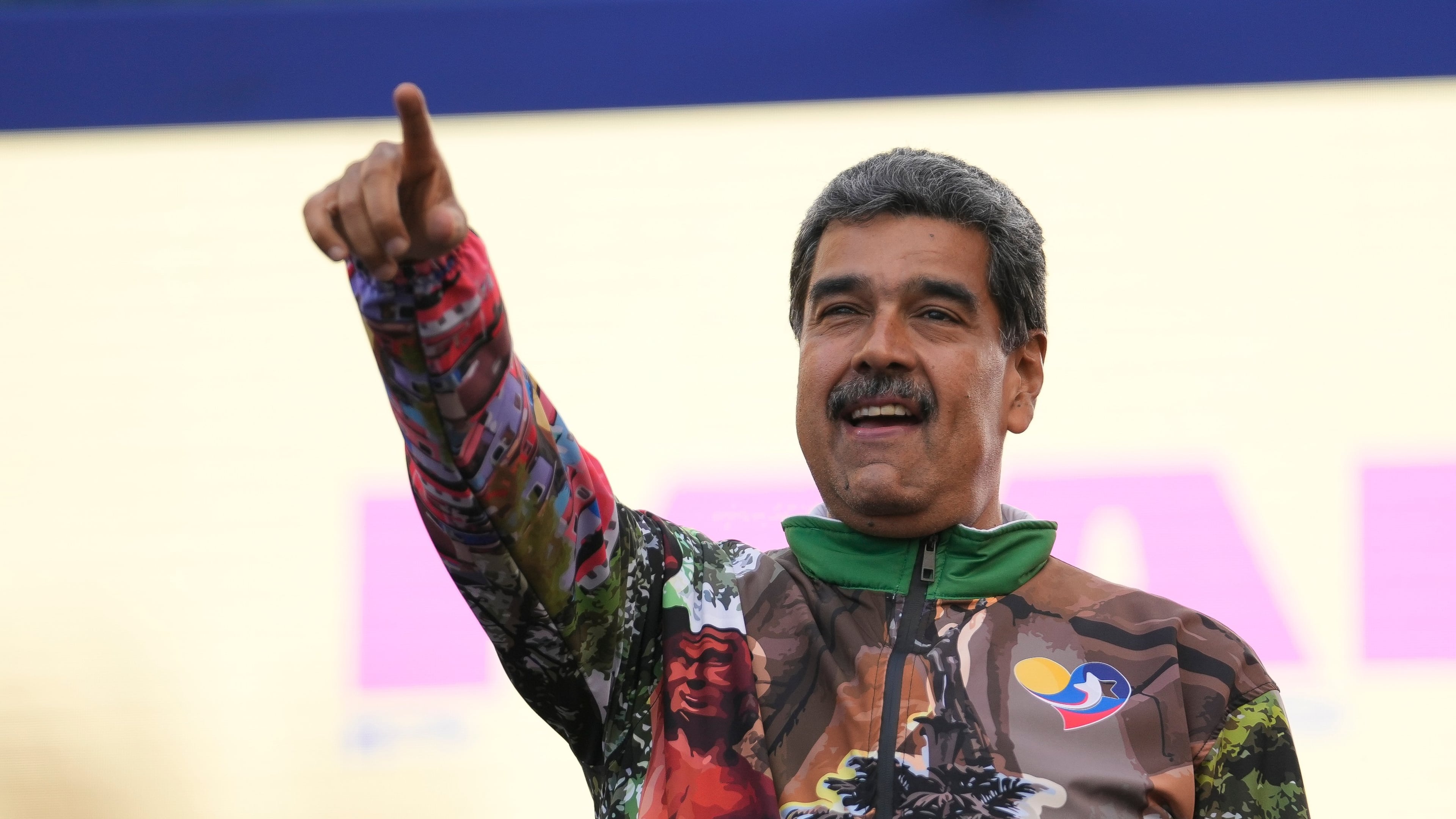FILE - Venezuelan President Nicolas Maduro points to supporters during a campaign rally in the Catia neighborhood of Caracas, Venezuela, July 18, 2024. (AP Photo/Matias Delacroix, File)