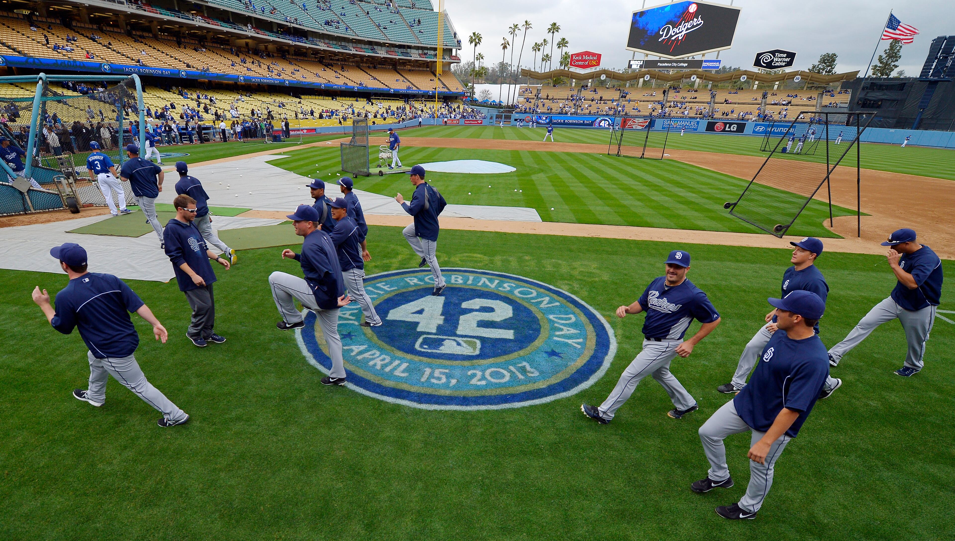 Members of the San Diego Padres warm up before their baseball game against the Los Angeles Dodgers, Monday, April 15, 2013, in Los Angeles.