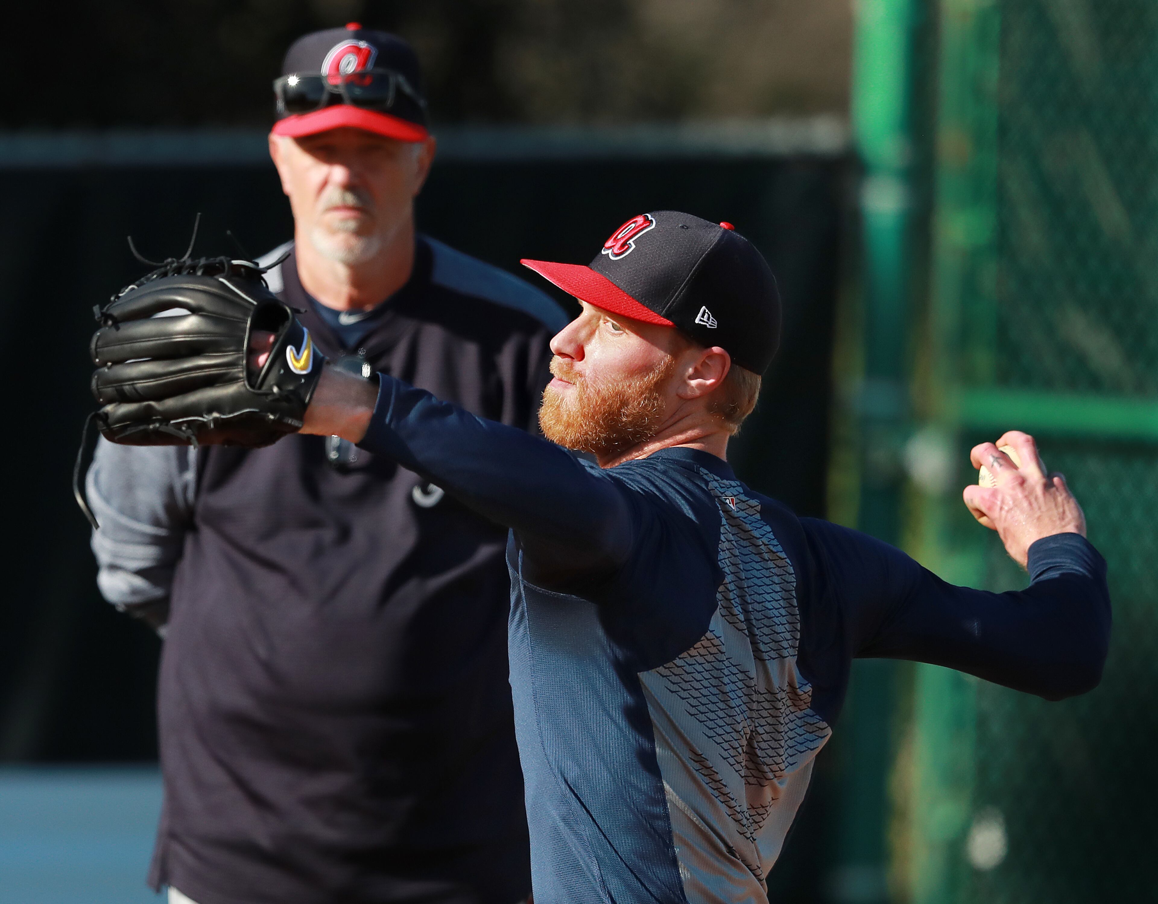 New pitching coach Rick Kranitz works with Mike Foltynewicz in the bullpen. (Curtis Compton/ccompton@ajc.com)