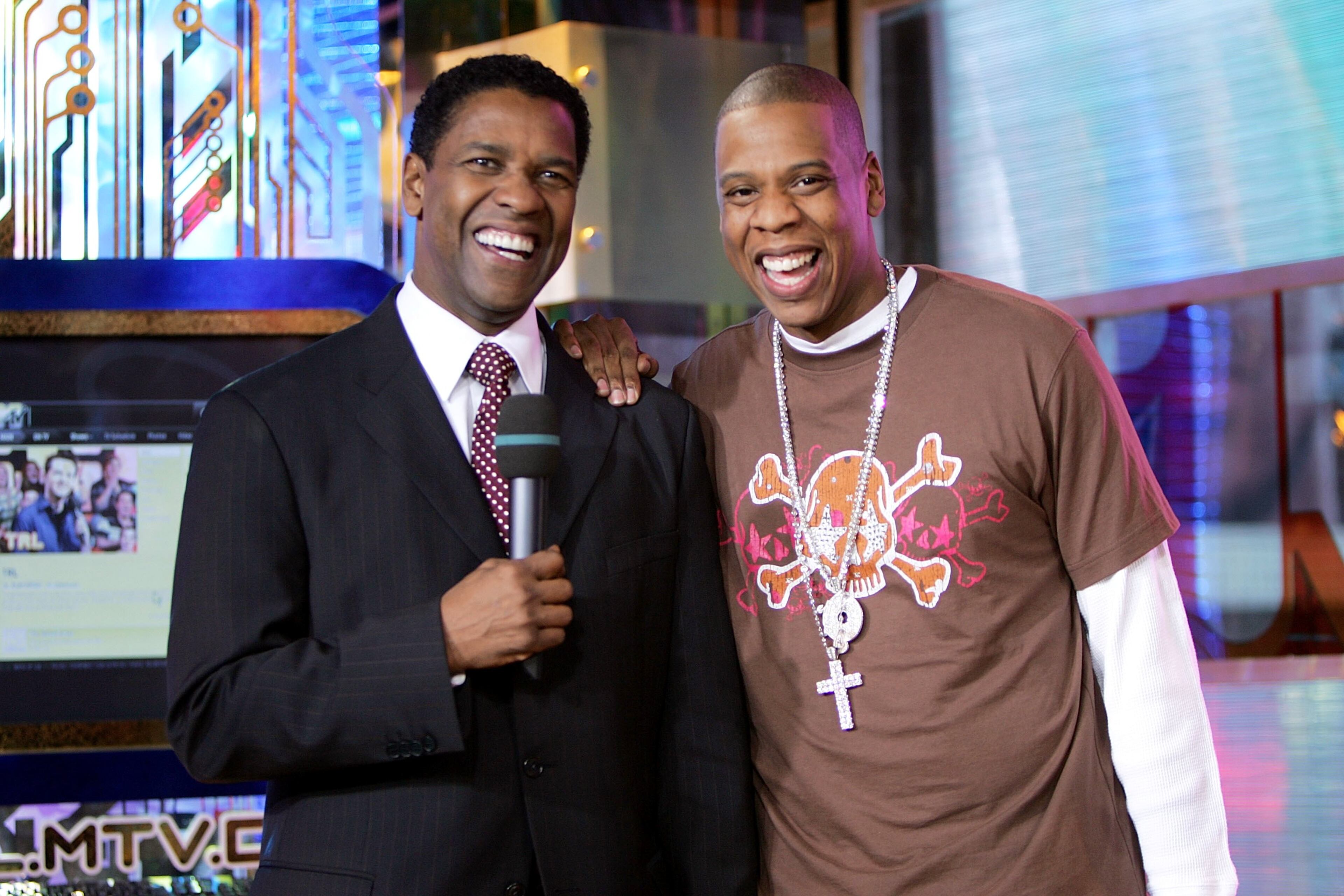 NEW YORK - NOVEMBER 20: (U.S. TABS OUT) Actor Denzel Washington and rapper Jay-Z appear onstage during MTV's Total Request Live at the MTV Times Square Studios on November 20, 2006 in New York City. (Photo by Scott Gries/Getty Images)