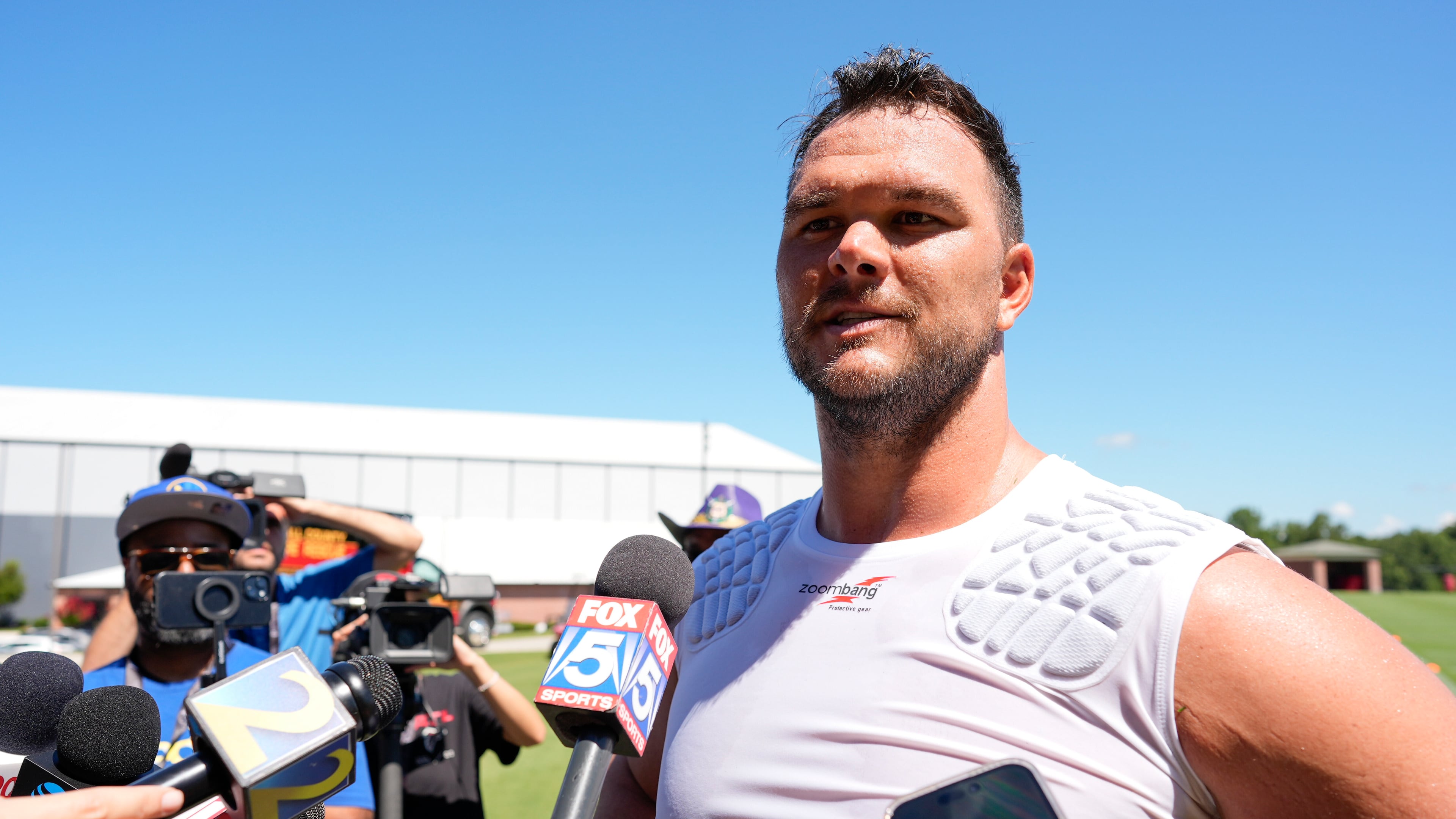 Atlanta Falcons offensive tackle Jake Matthews speaks during Falcons training camp, Saturday, July 26, 2025, in Flowery Branch. (Mike Stewart/AP)