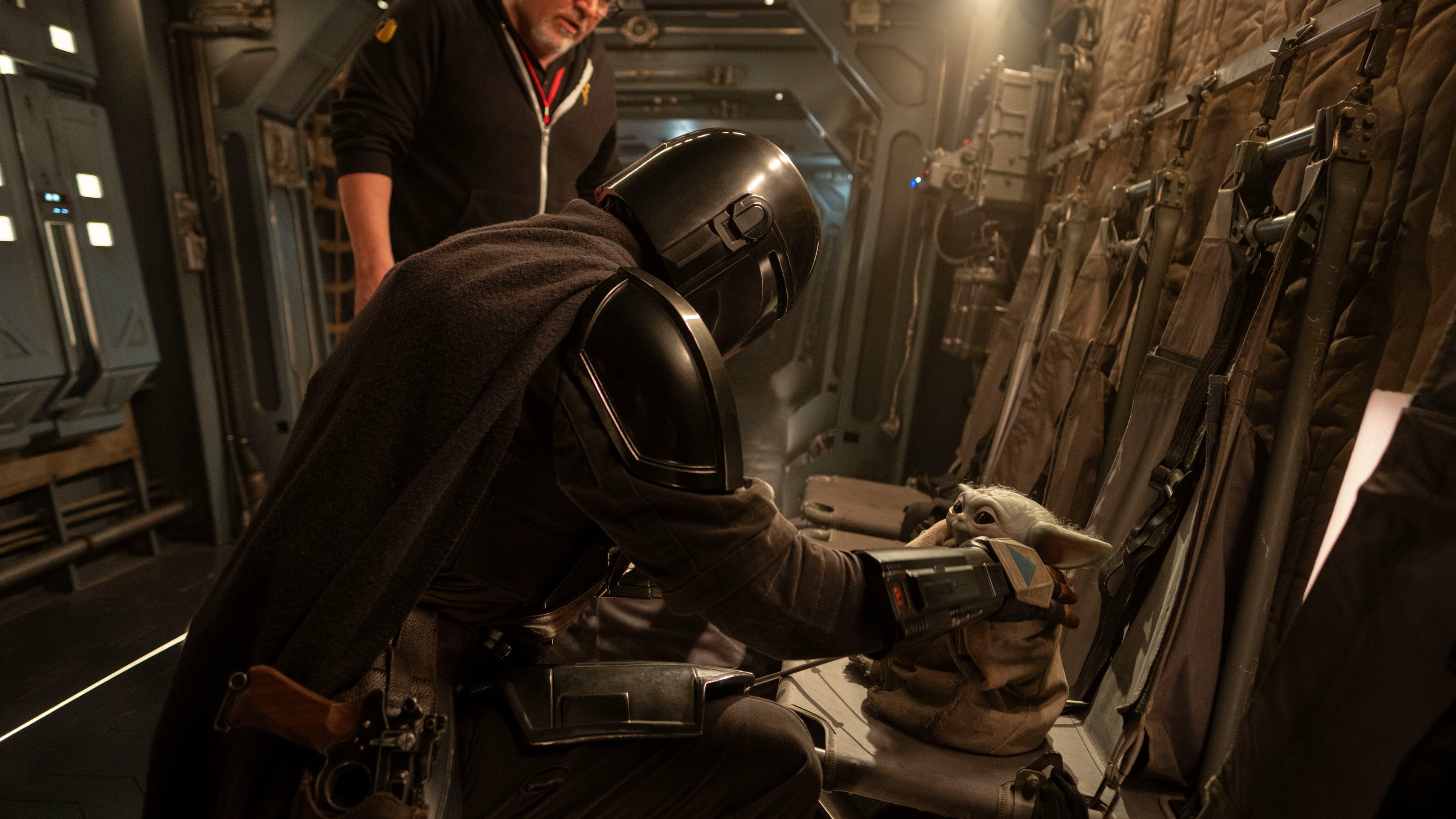 This image released by Disney shows director Jon Favreau, left, and Pedro Pascal on the set of Lucasfilm's "Star Wars: The Mandalorian and Grogu." (Francois Duhamel/Lucasfilm Ltd./Disney via AP)