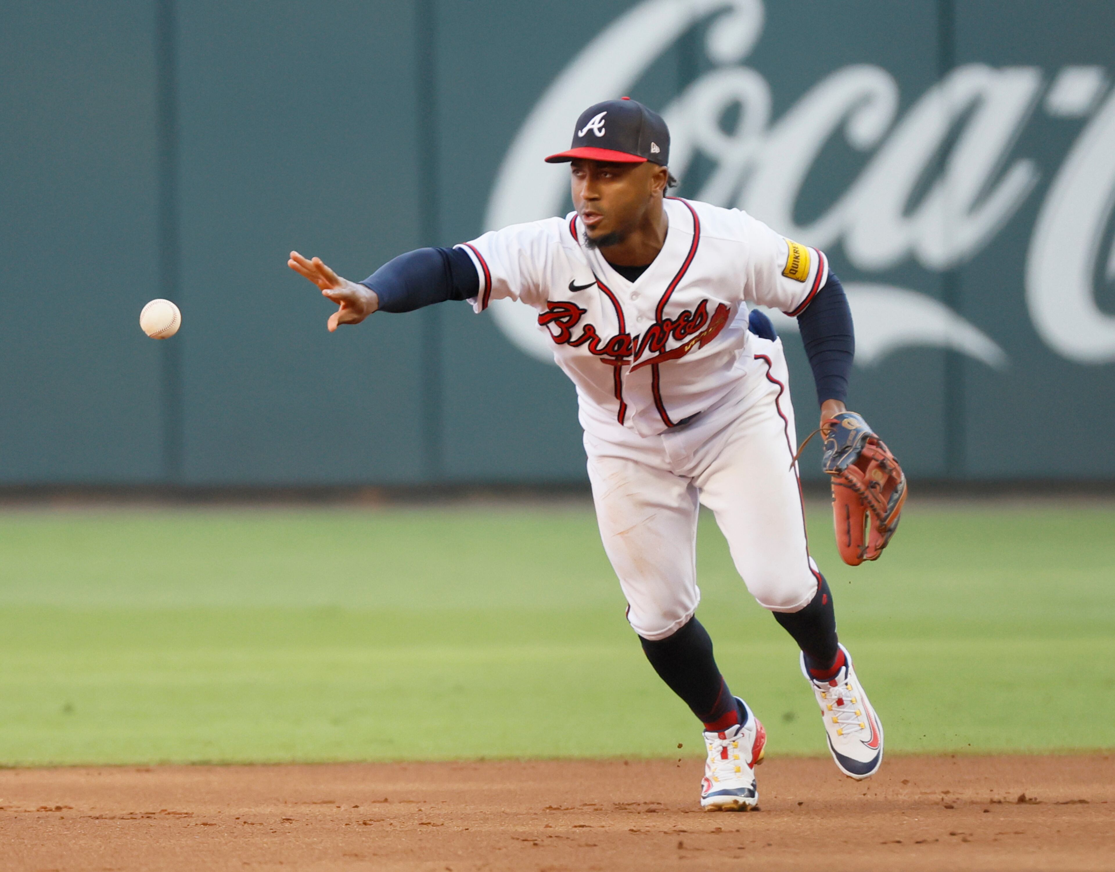 Atlanta Braves second baseman Ozzie Albies flips ball to Orlando Arcia to complete double play in first inning during Game 1 of the NLDS at Truist Park. (Miguel Martinez / Miguel.Martinezjimenez@ajc.com)