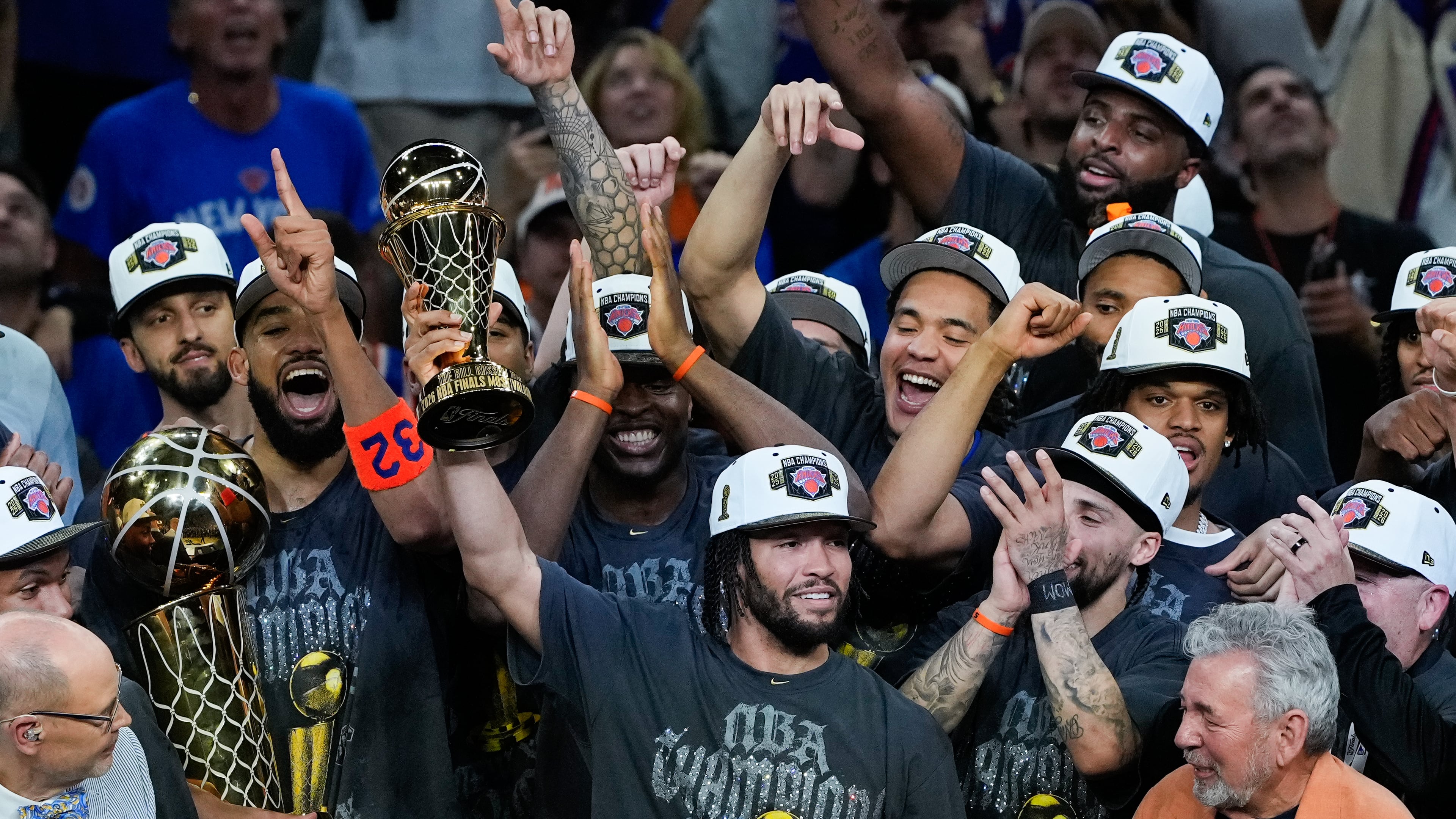 New York Knicks guard Jalen Brunson holds the MVP trophy after the Knicks defeated the San Antonio Spurs in Game 5 of the NBA Finals basketball series, Saturday, June 13, 2026, in San Antonio. (AP Photo/Ross D. Franklin)