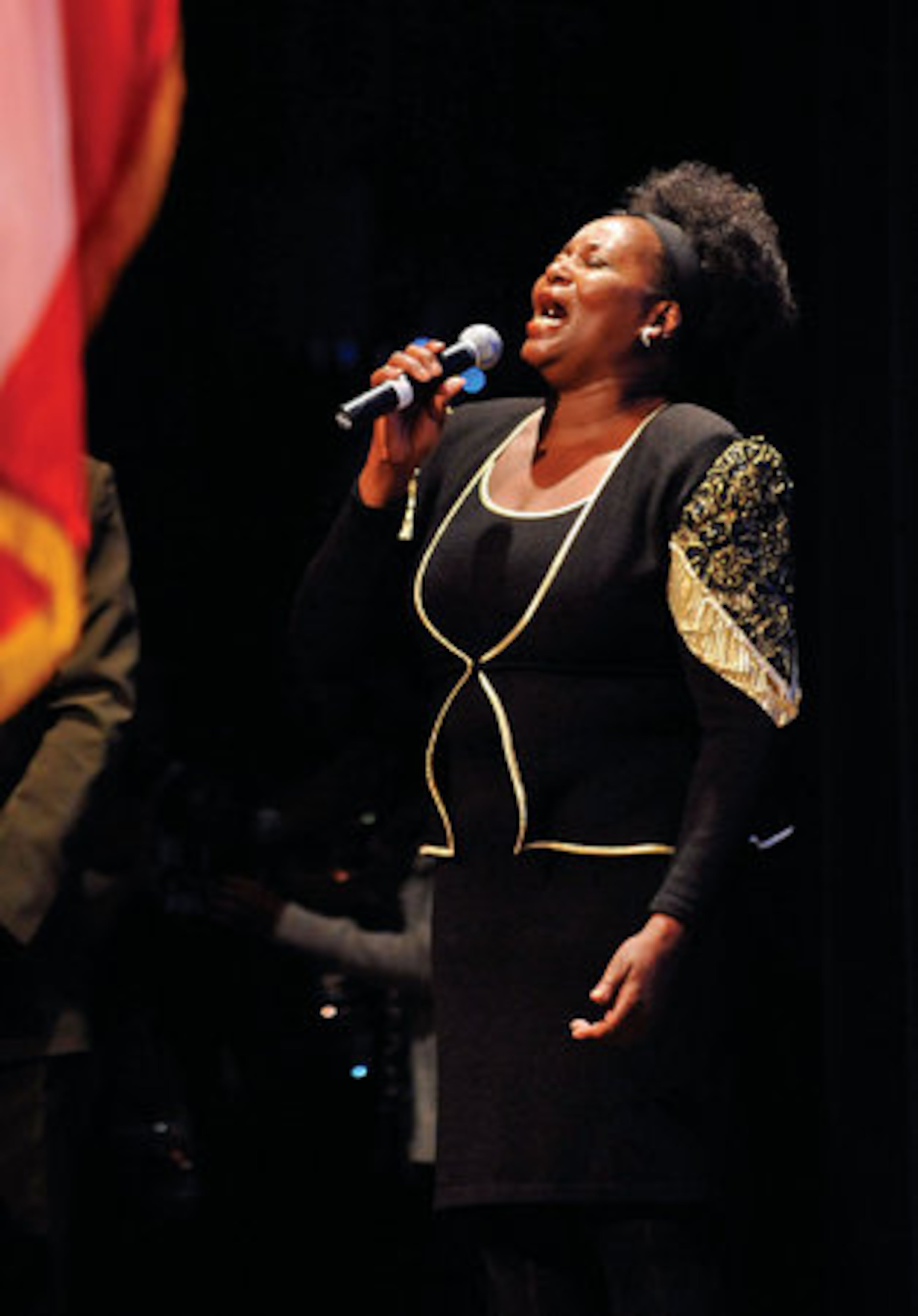 MaRayun Neals sing "The Star Spangled Banner."