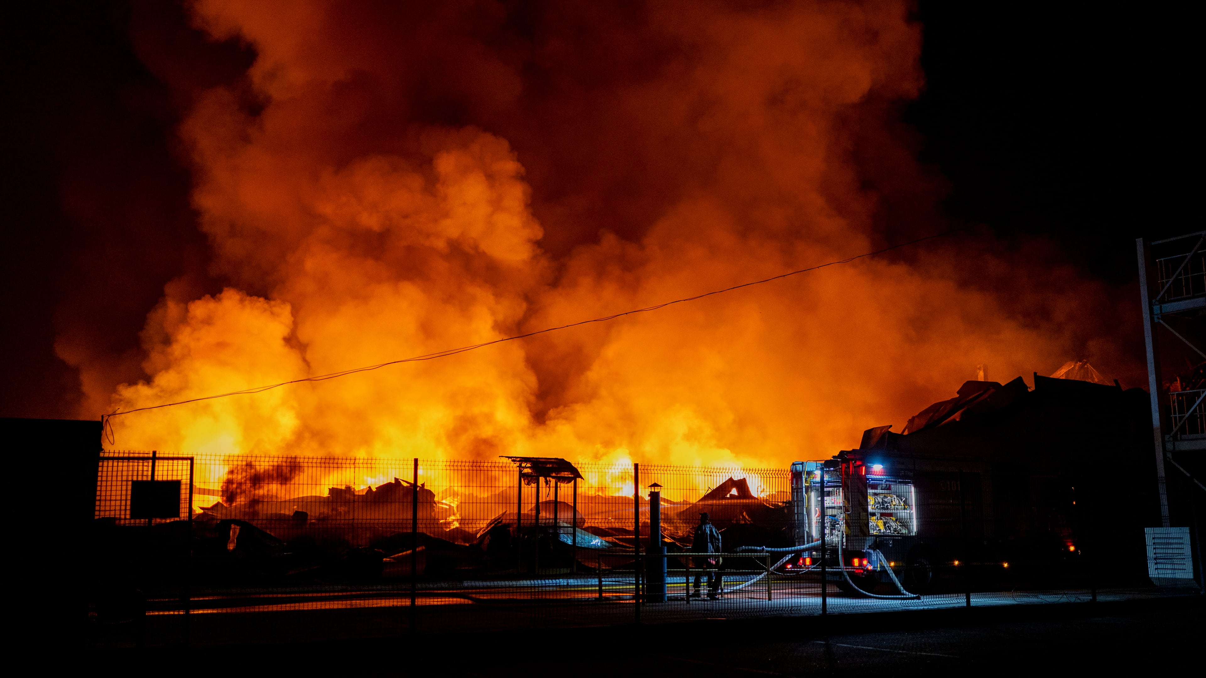 Firefighters put out a fire after Russian missiles hit a warehouse in Kyiv, Ukraine, Wednesday, Aug. 5, 2026. (AP Photo/Dan Bashakov)