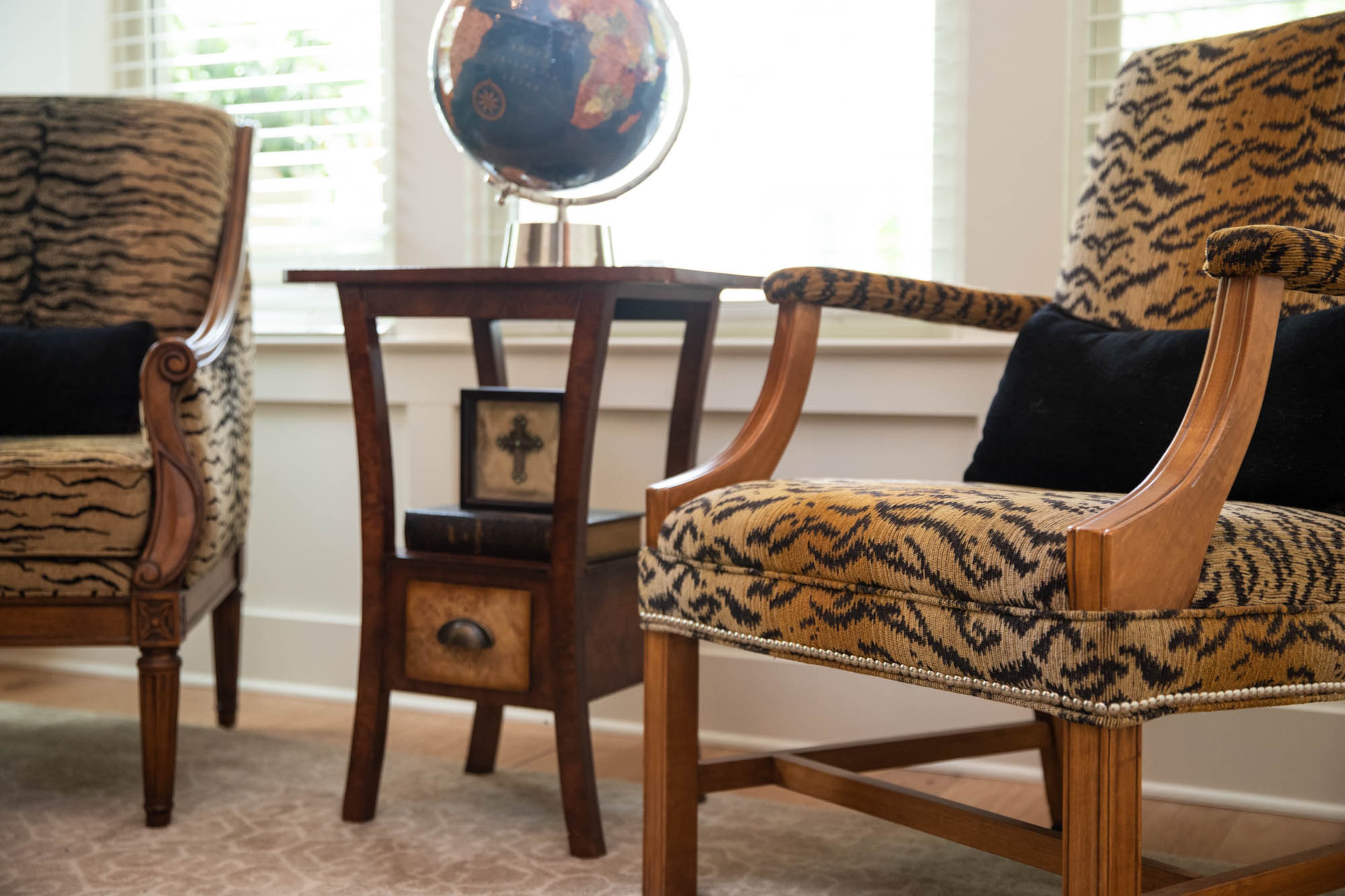 While animal print chairs aren't a look that Patti Dixon ever would've thought she'd fall in love with, when she saw this pair of chairs she knew she had to have them. "It was the wood accents," said Patti. "There was just something that drew me to them." They now sit in her husband Scott Dixon's office.