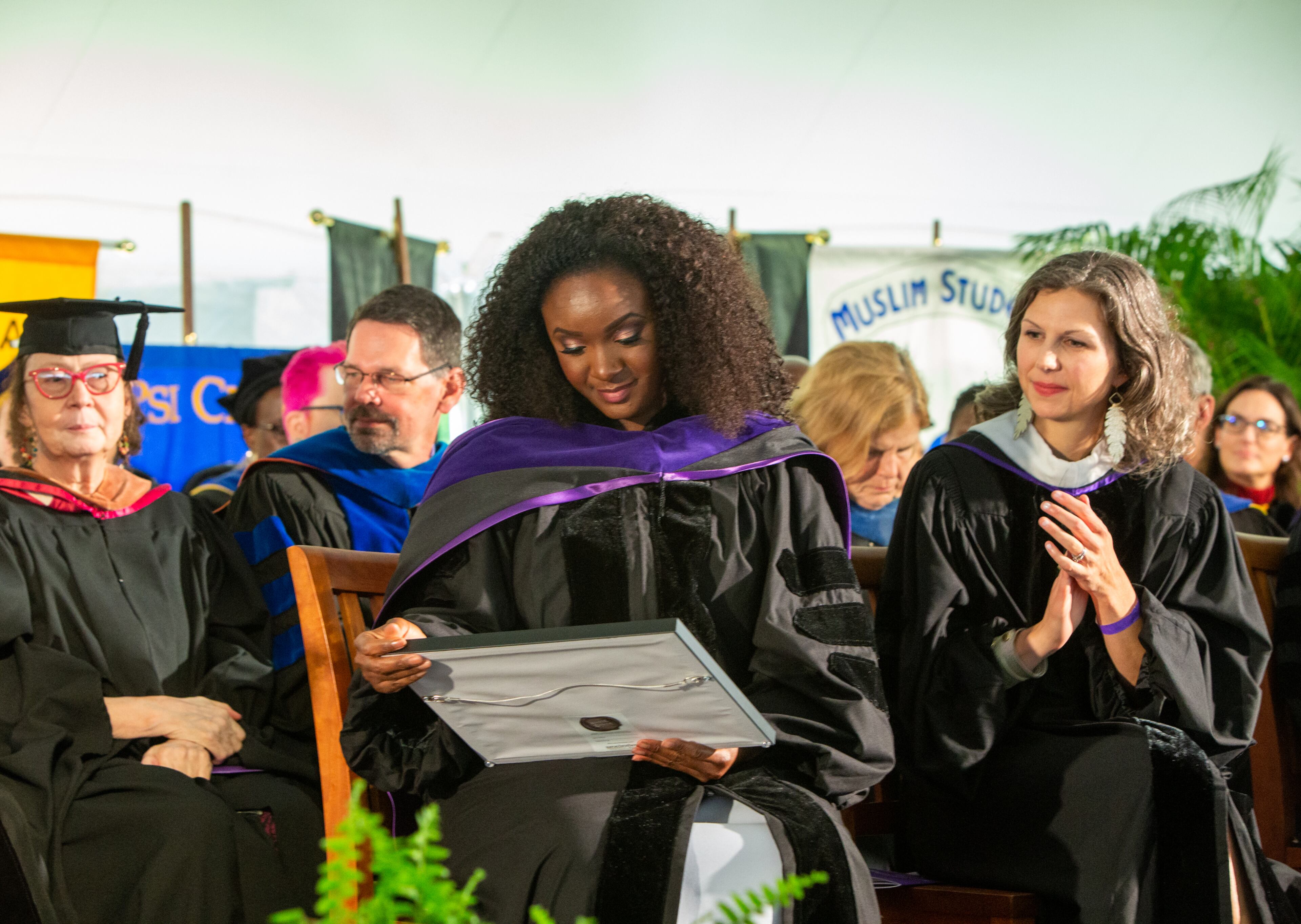 Actress and singer Saycon Sengbloh, who gave the commencement address, is presented with an honorary degree at the Agnes Scott College commencement on Saturday, May 14, 2022. (Jenni Girtman for The Atlanta Journal-Constitution)