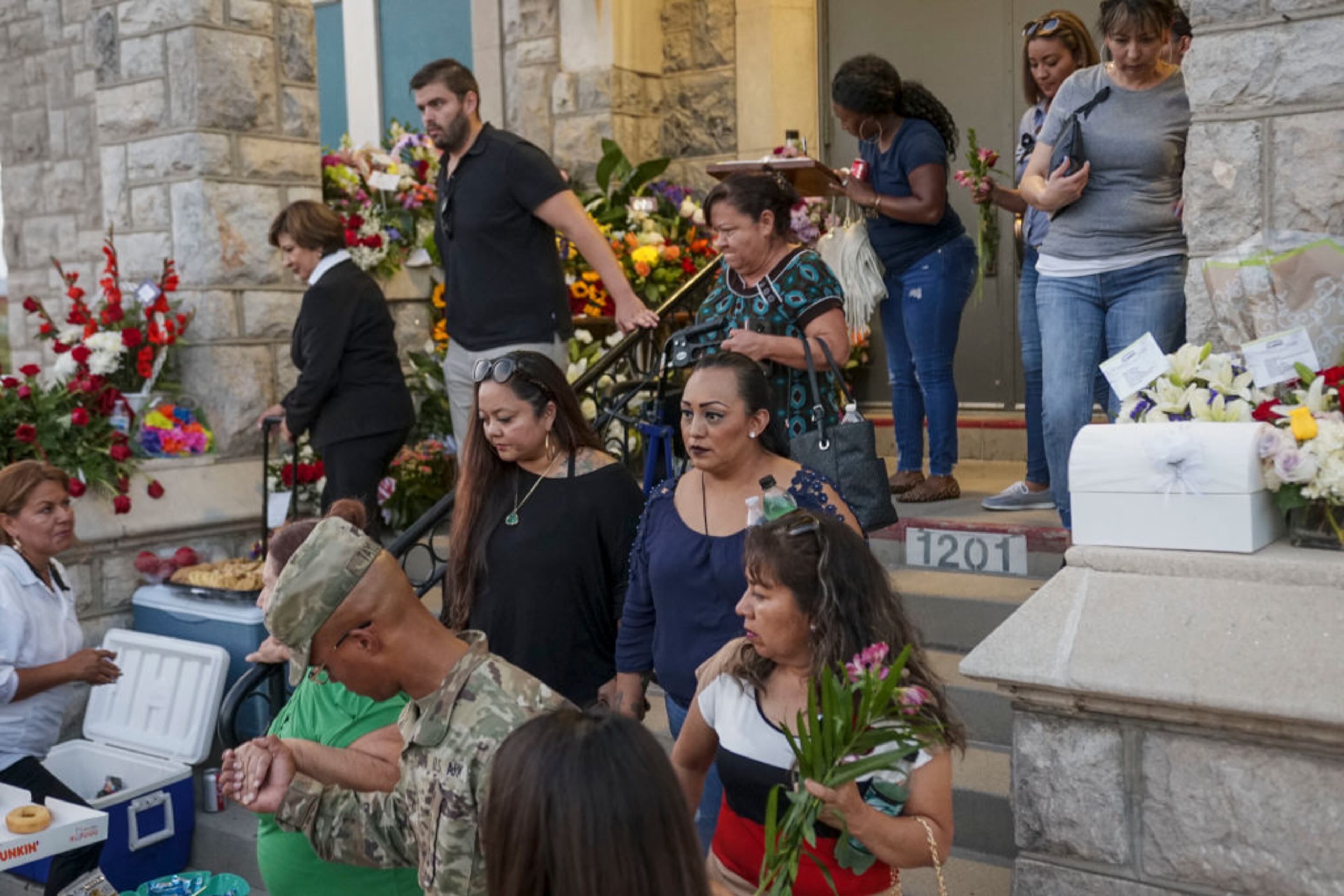 EL PASO, TX - AUGUST 16: Well wishers stand in line to pay their respects during a public memorial for Margie Reckard on August 16, 2019 in El Paso, Texas. Reckard was one of 22 killed during the Walmart shooting in El Paso on August 3rd. Her husband, Antonio Basco, invited the public to attend the memorial in her honor and has laid fresh flowers everyday since the shooting at a make-shift memorial outside the outlet.(Photo by Sandy Huffaker/Getty Images)