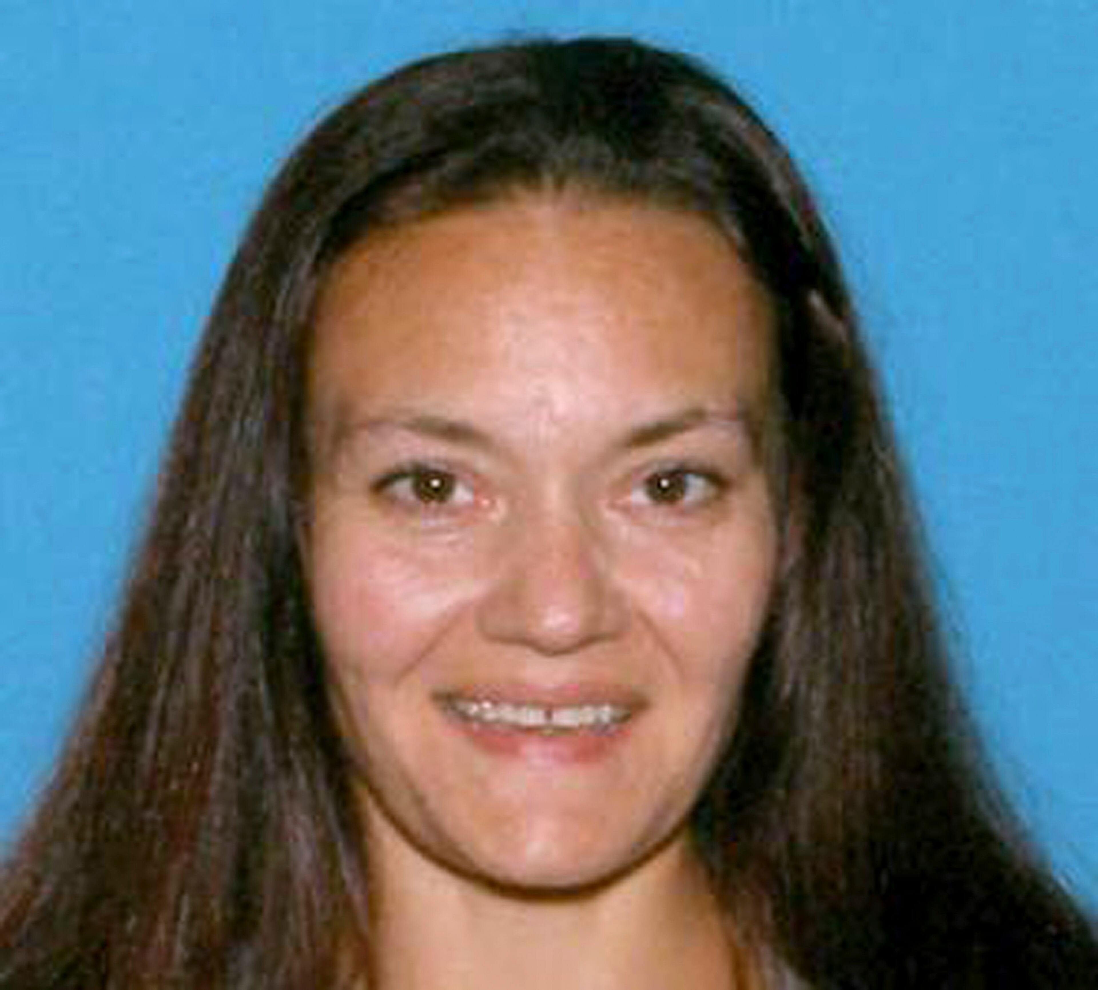 CORRECTS NAME TO RACHELLE FROM RACHEL - This undated identification photo released Friday, Sept. 18, 2015 by the Suffolk County District Attorney's Office shows Rachelle Bond, mother of Bella Bond, the toddler whose body was found in a trash bag on a Boston Harbor beach in June and who was known for months as only Baby Doe. Rachelle Bond was arrested and charged as an accessory to murder after the fact in Bella's death. Her boyfriend, Michael McCarthy, was charged with murder. (Suffolk County District Attorney's Office via AP)