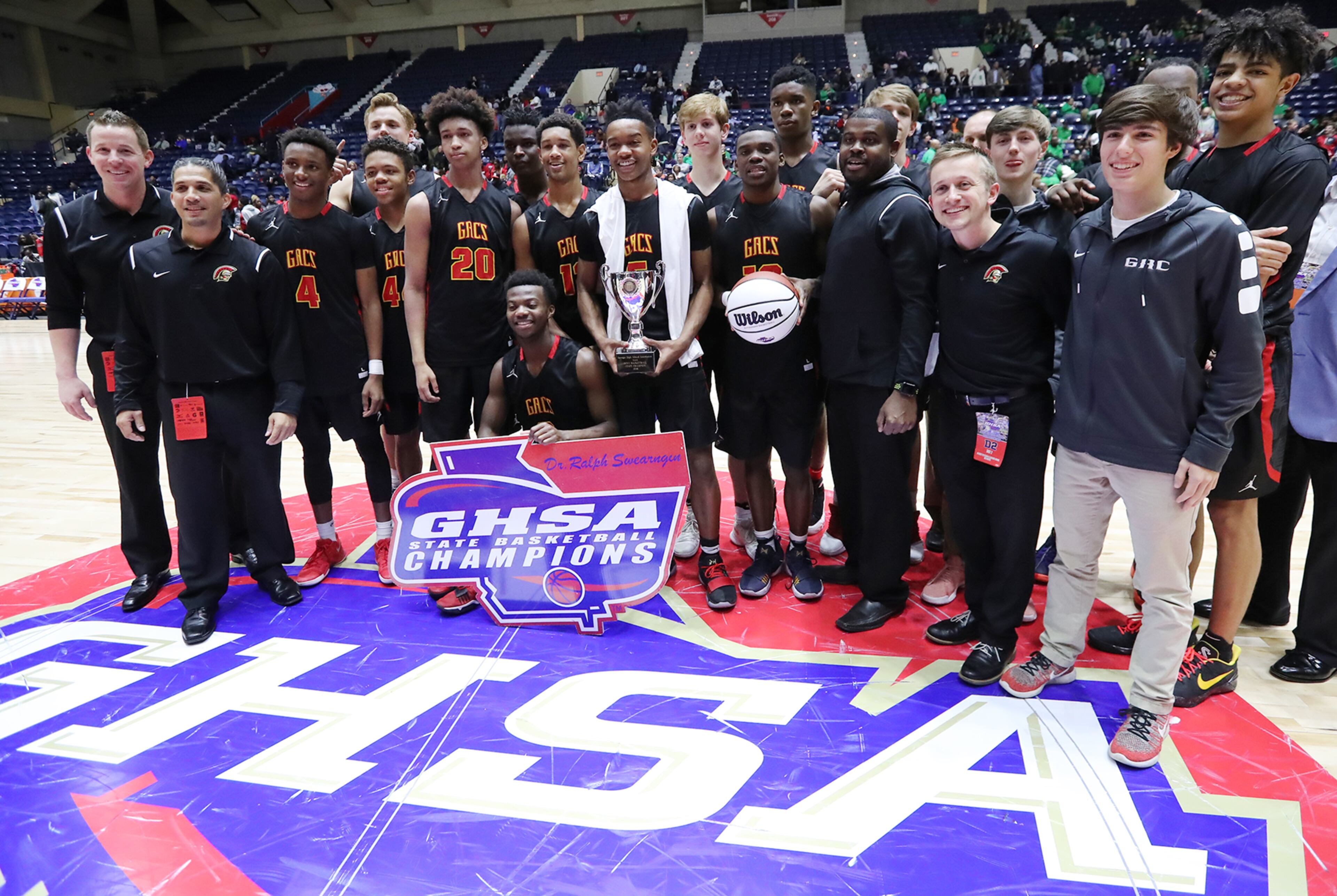 March 8, 2018 Macon: GAC is presented their trophy after beating Jenkins 67-53 in their GHSA state basketball championship game on Thursday, March 8, 2018, in Macon. Curtis Compton/ccompton@ajc.com