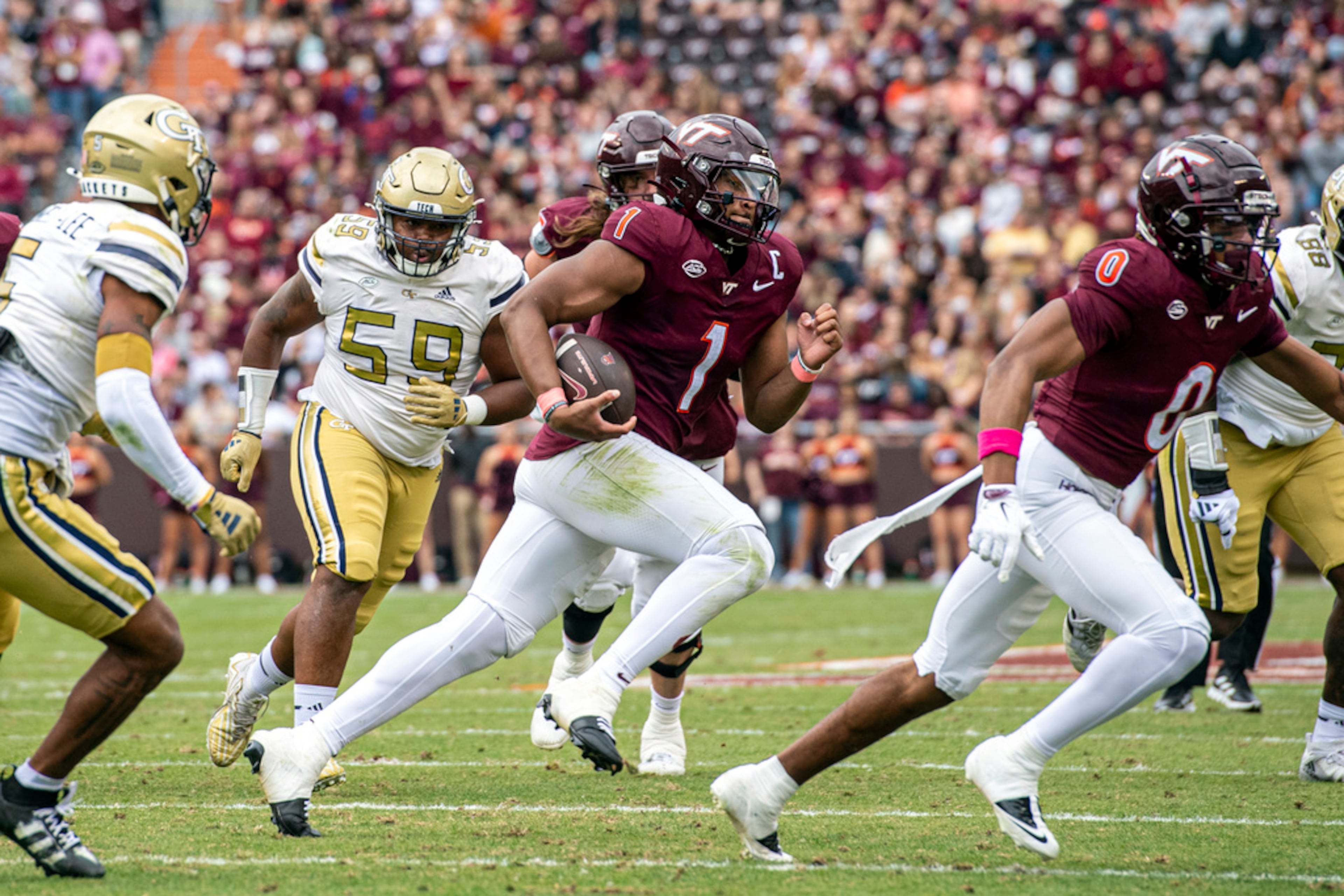 Virginia Tech's Kyron Drones (1) runs for a big gain against Georgia Tech during the first half of an NCAA college football game, Saturday, Oct. 26, 2024, in Blacksburg, Va. (AP Photo/Robert Simmons)