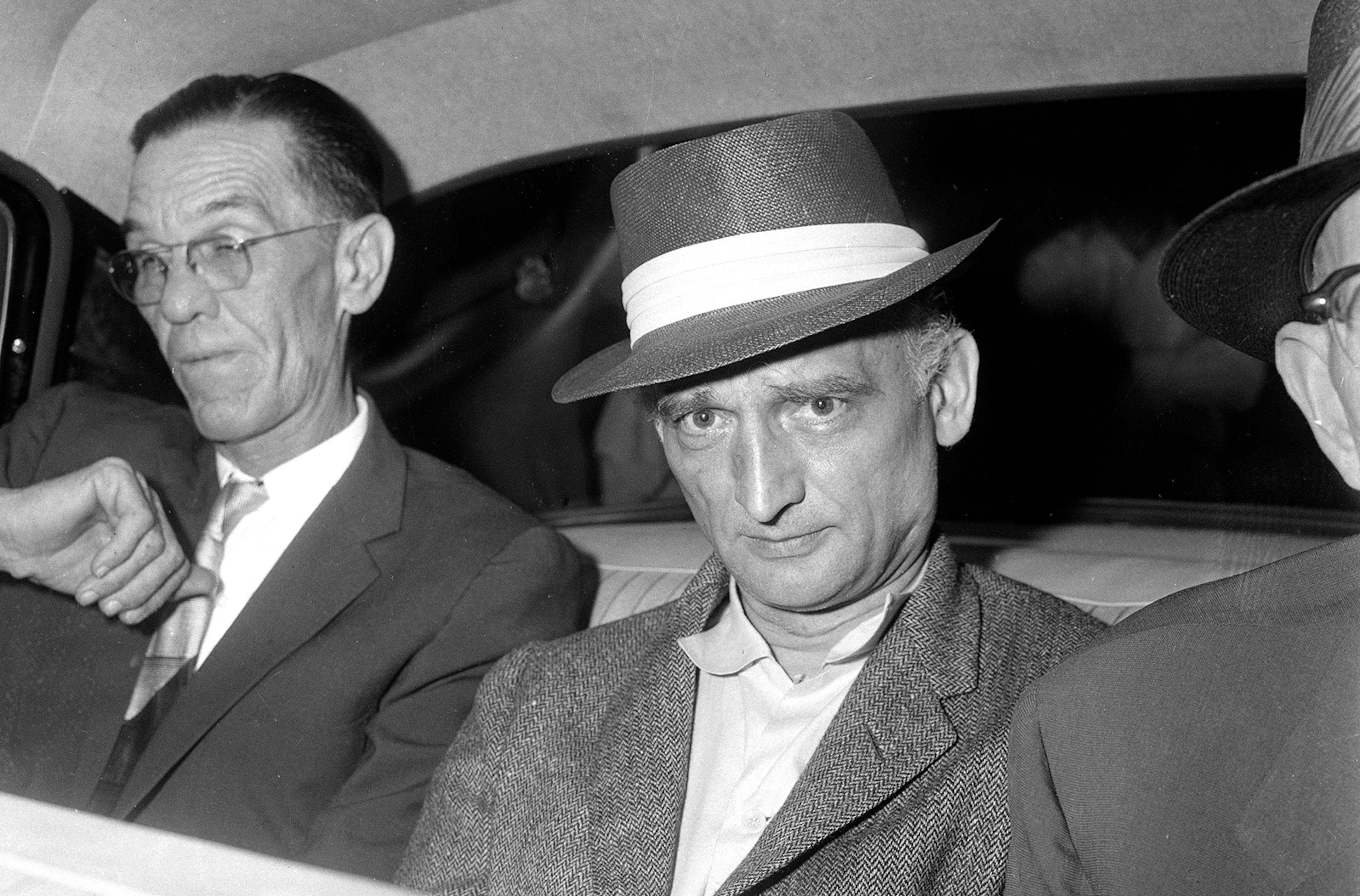 William Fisher, better known by his alias Rudolf Abel, center, was a Soviet spy operating in New York in the 1950s. He was captured as part of the FBI's Hollow Nickel Case and spent four years at the Atlanta Federal Penitentiary before being released to the Soviet Union. His release was part of a prisoner swap for Gary Powers, the American U-2 pilot shot down over the Soviet Union in 1960. The story was recounted in a 1964 book, which served as the basis for the 2015 Steven Spielberg film "Bridge of Spies," starring Tom Hanks. (Marty Lederhandler / AP file)
