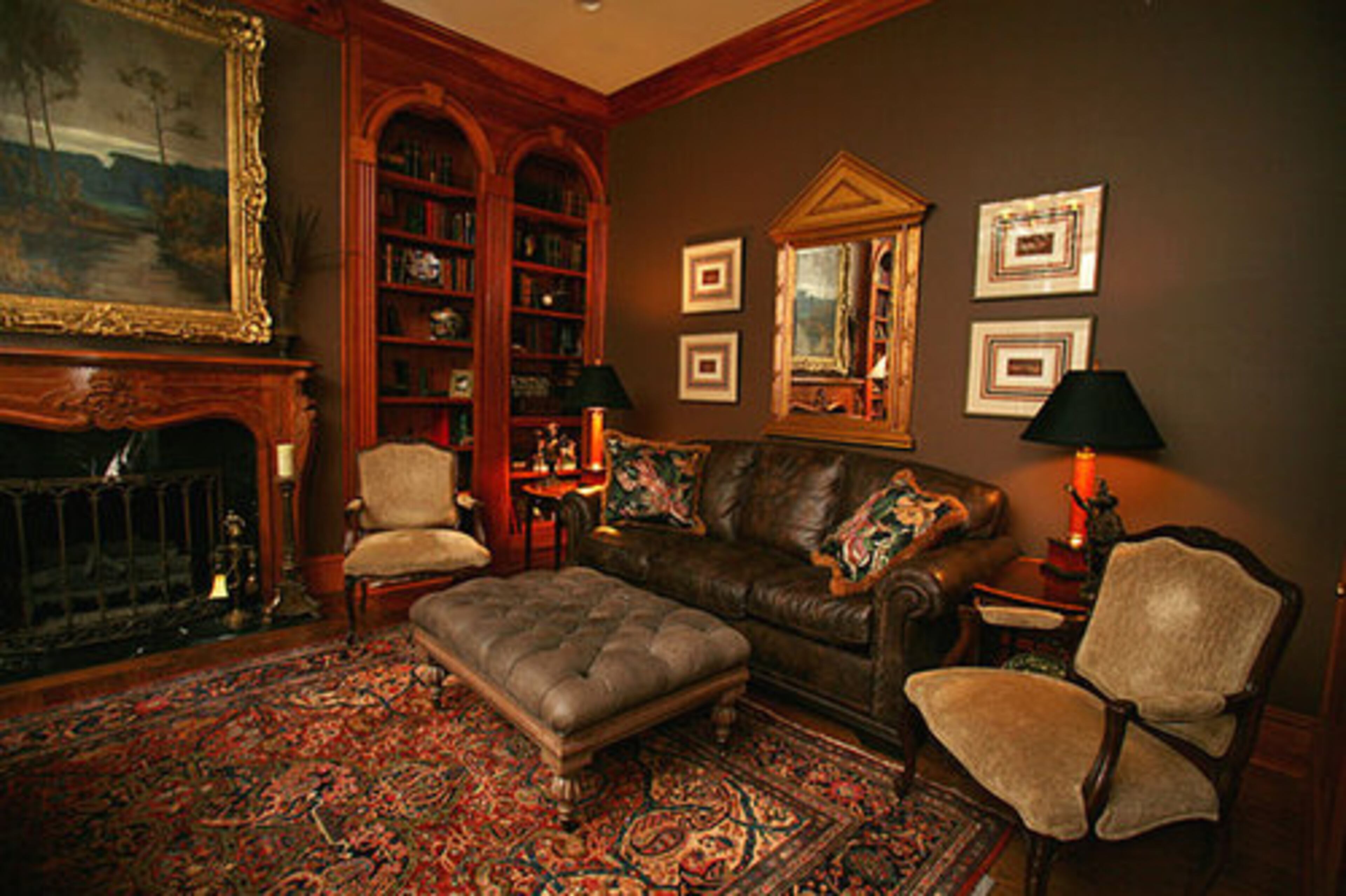 To the left of the foyer, this clubby home office employs hunting prints and arched bookshelves to make night and weekend work a less burdensome endeavor. Stephen Pararo of Atlanta's Pineapple House Interior Design helped the Bartons achieve a look that was attractive without being imposing. "Our goal was to keep it comfortable," Barton said. "We didn't want to overdecorate."