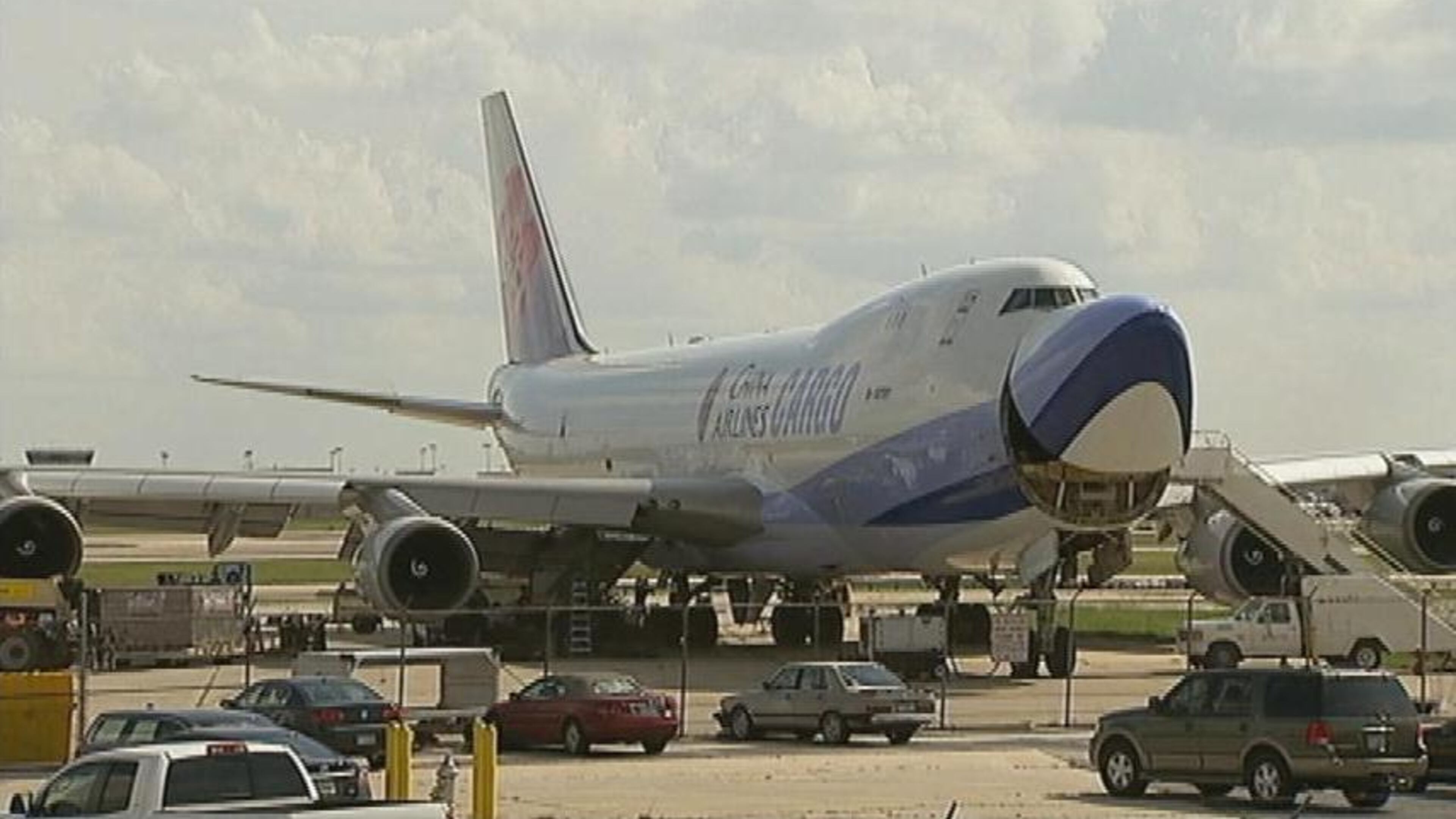 Federal authorities are investigating why pieces of a 747 cargo plane crashed into the woman's house Sunday afternoon.