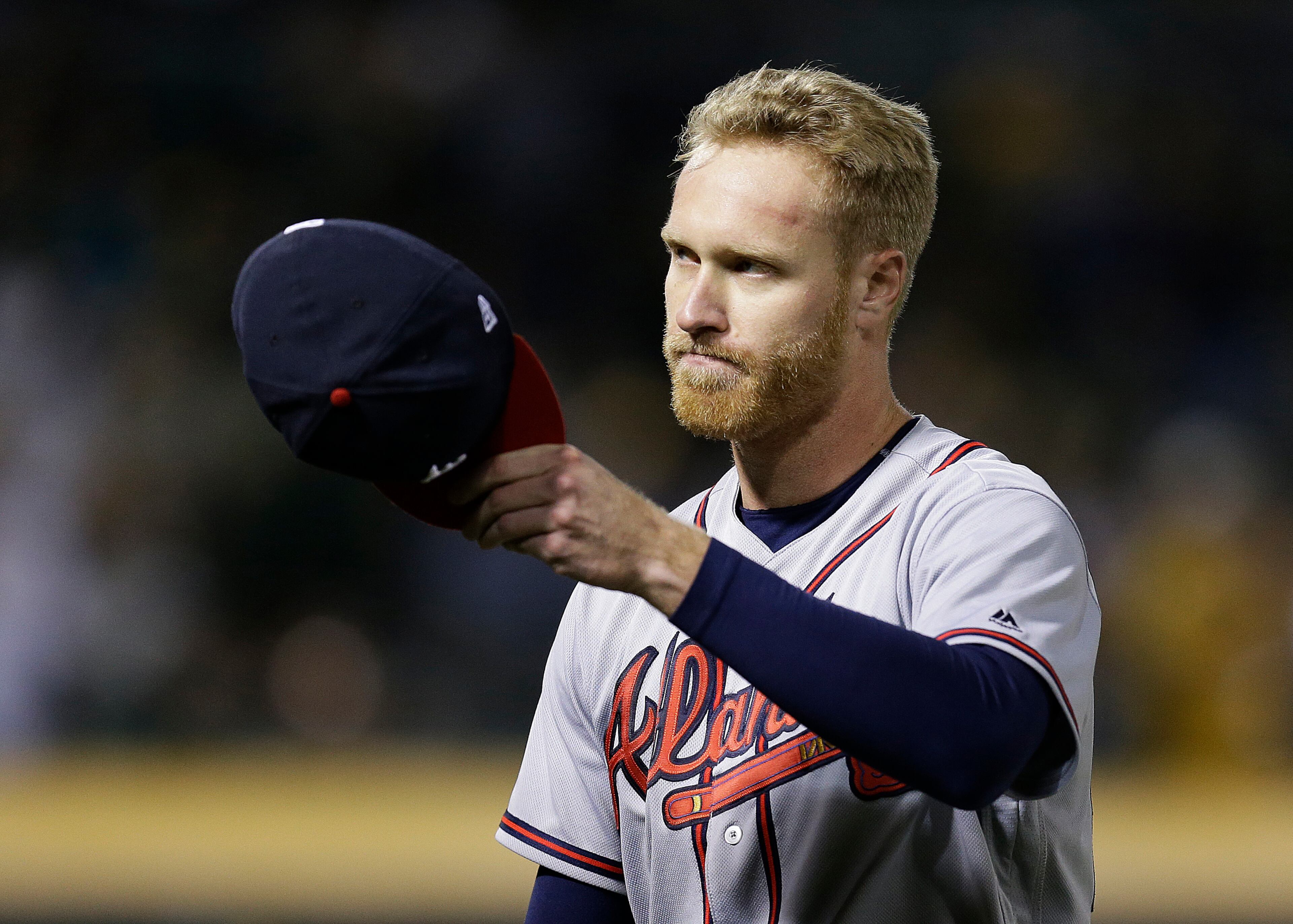 Atlanta Braves pitcher Mike Foltynewicz tips his hat to fans as he leaves in the ninth inning of the team's baseball game against the Oakland Athletics on Friday, June 30, 2017, in Oakland, Calif. (AP Photo/Ben Margot)